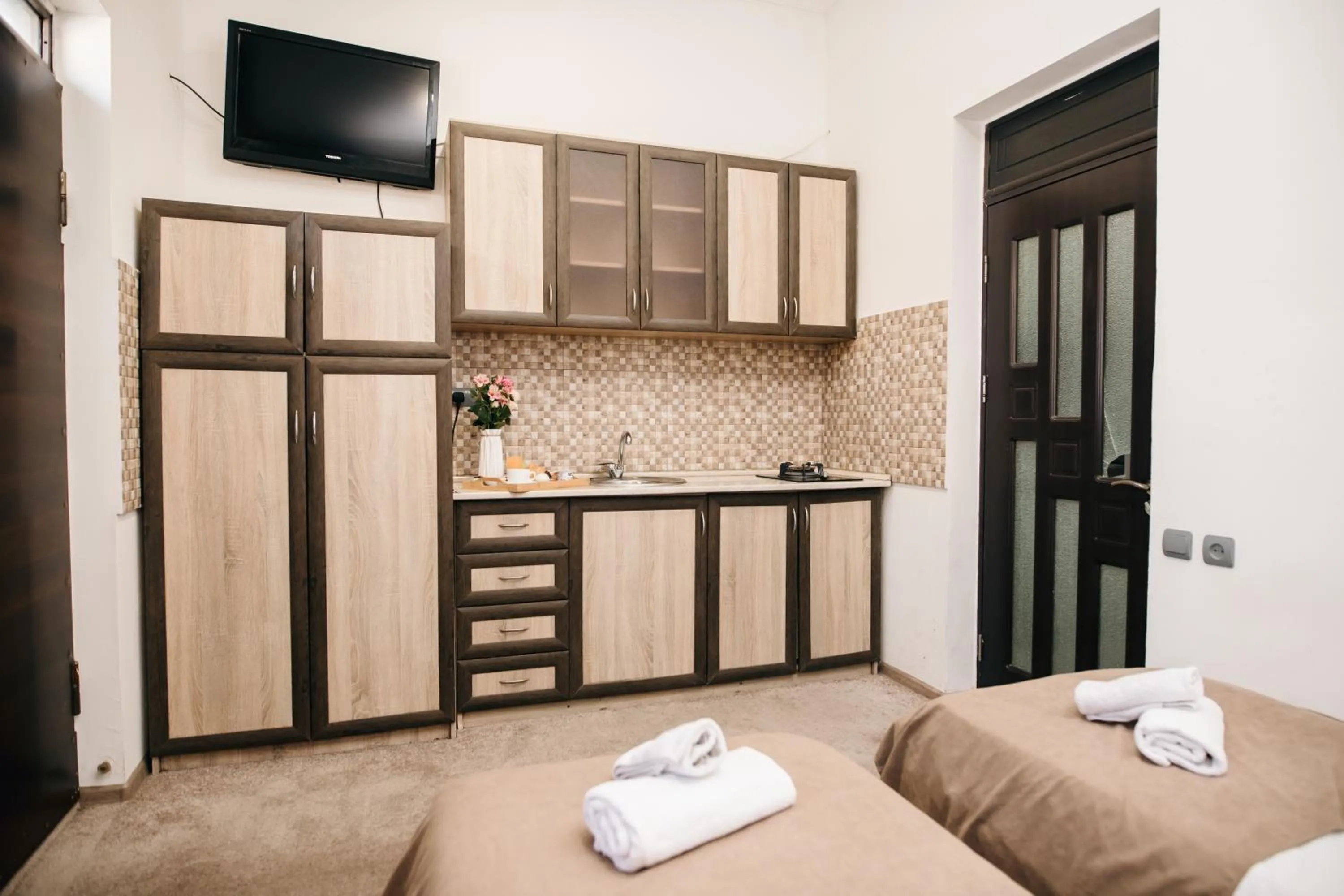 Kitchen or kitchenette, Bed in Nuryan Hotel Yerevan