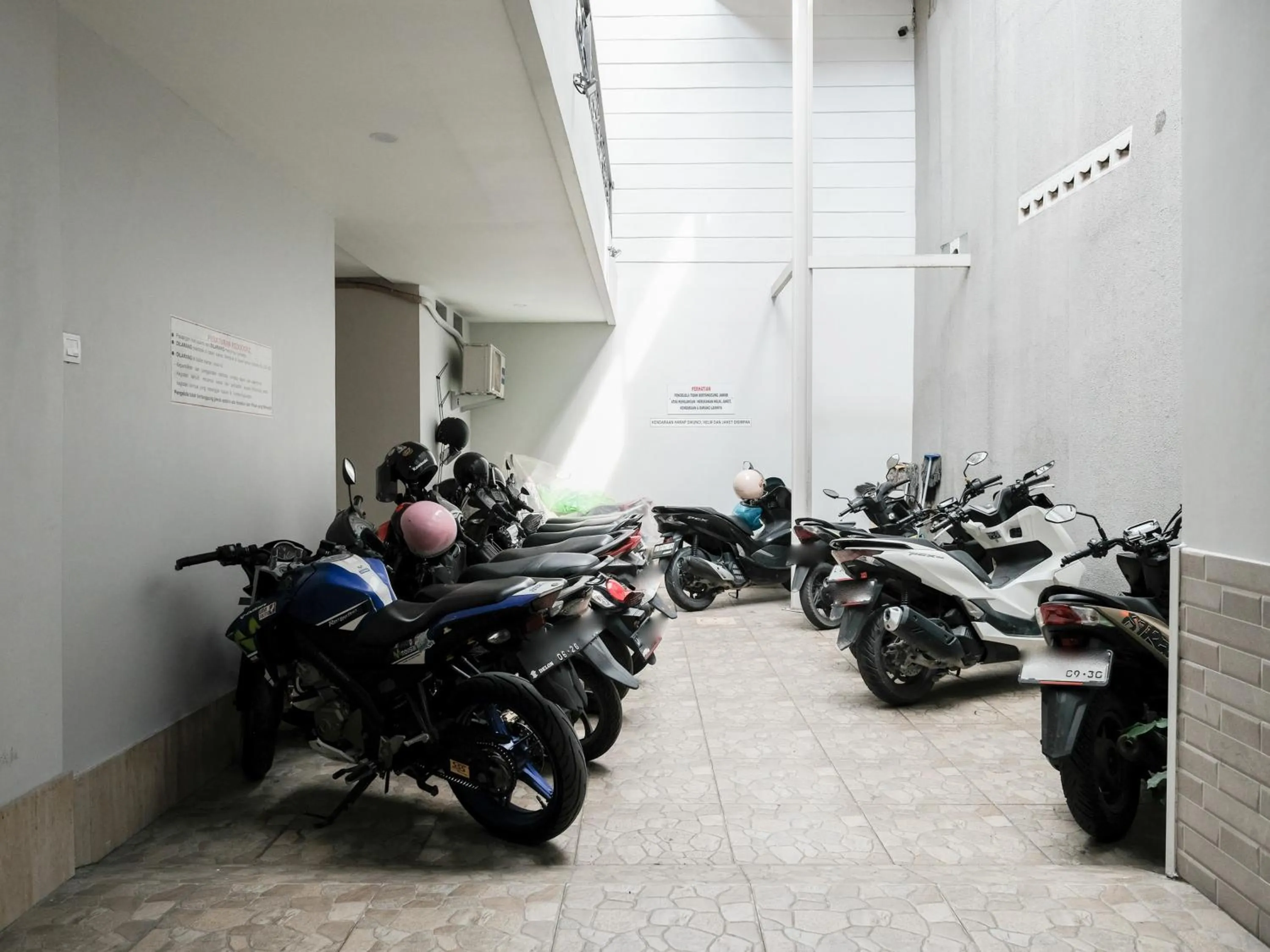 Parking in RedDoorz near Ciputra Golf Surabaya