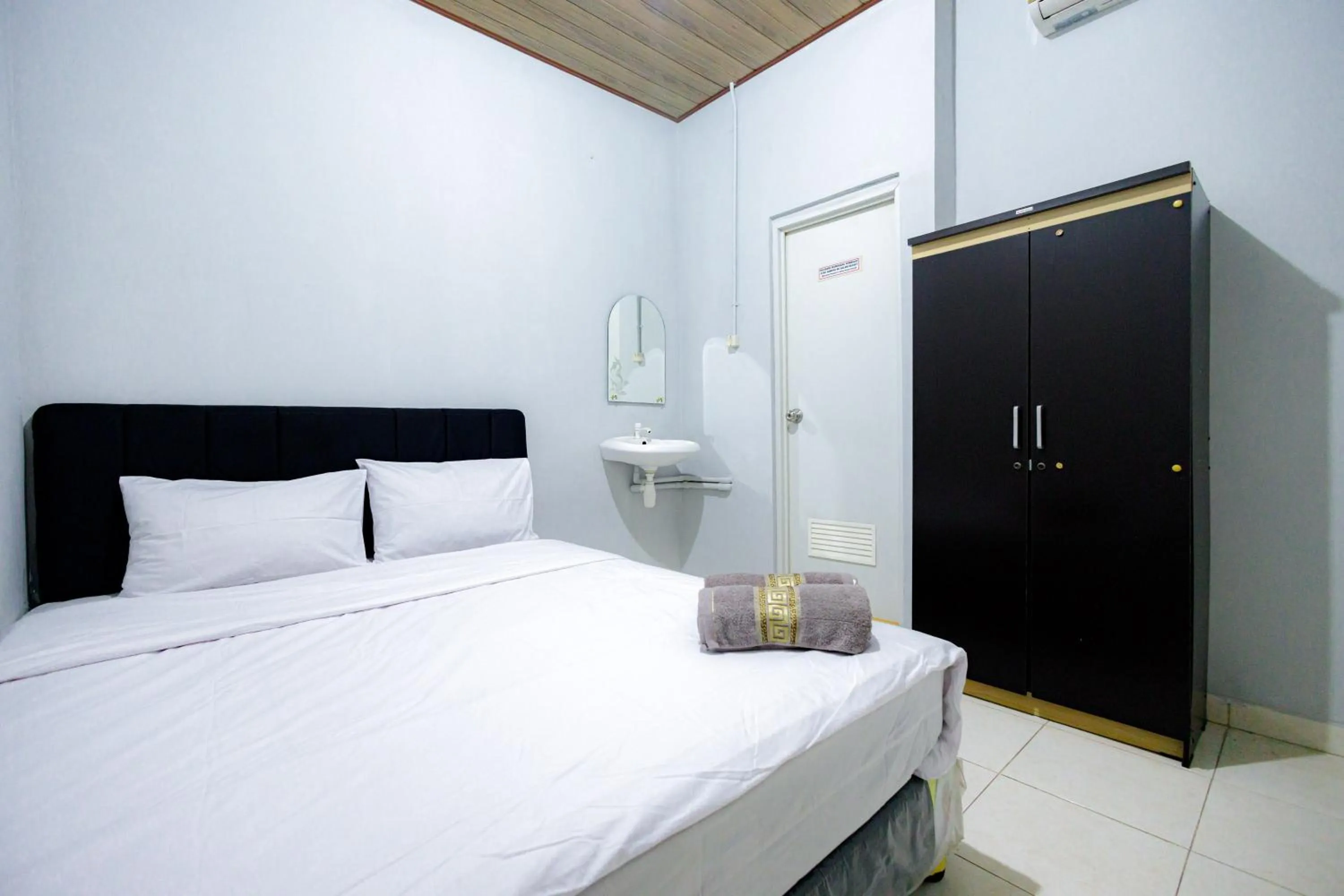Bed in Marcello Residence Siwalankerto near Petra University Surabaya Mitra RedDoorz