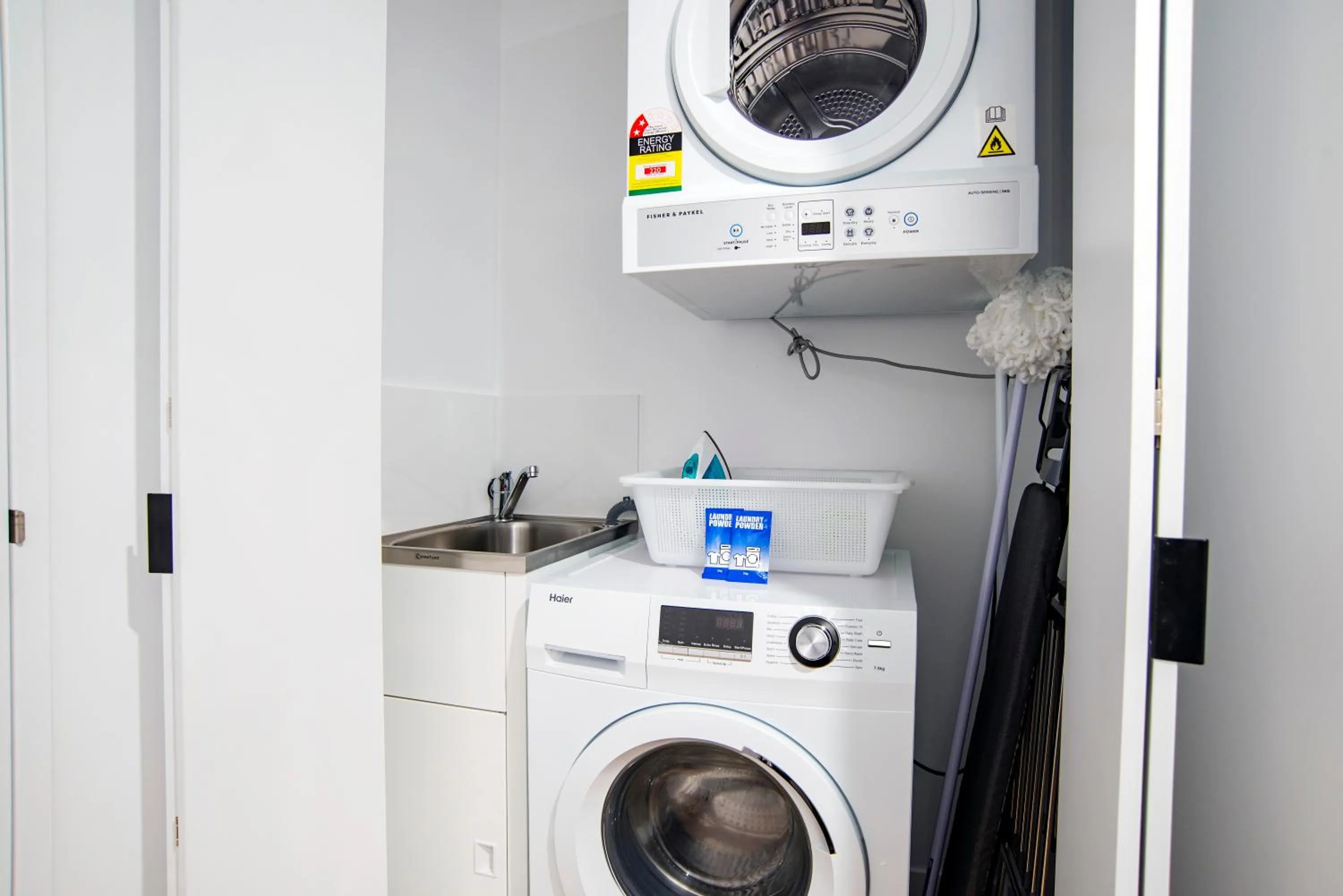 washing machine in Brisbane One Apartments by CLLIX
