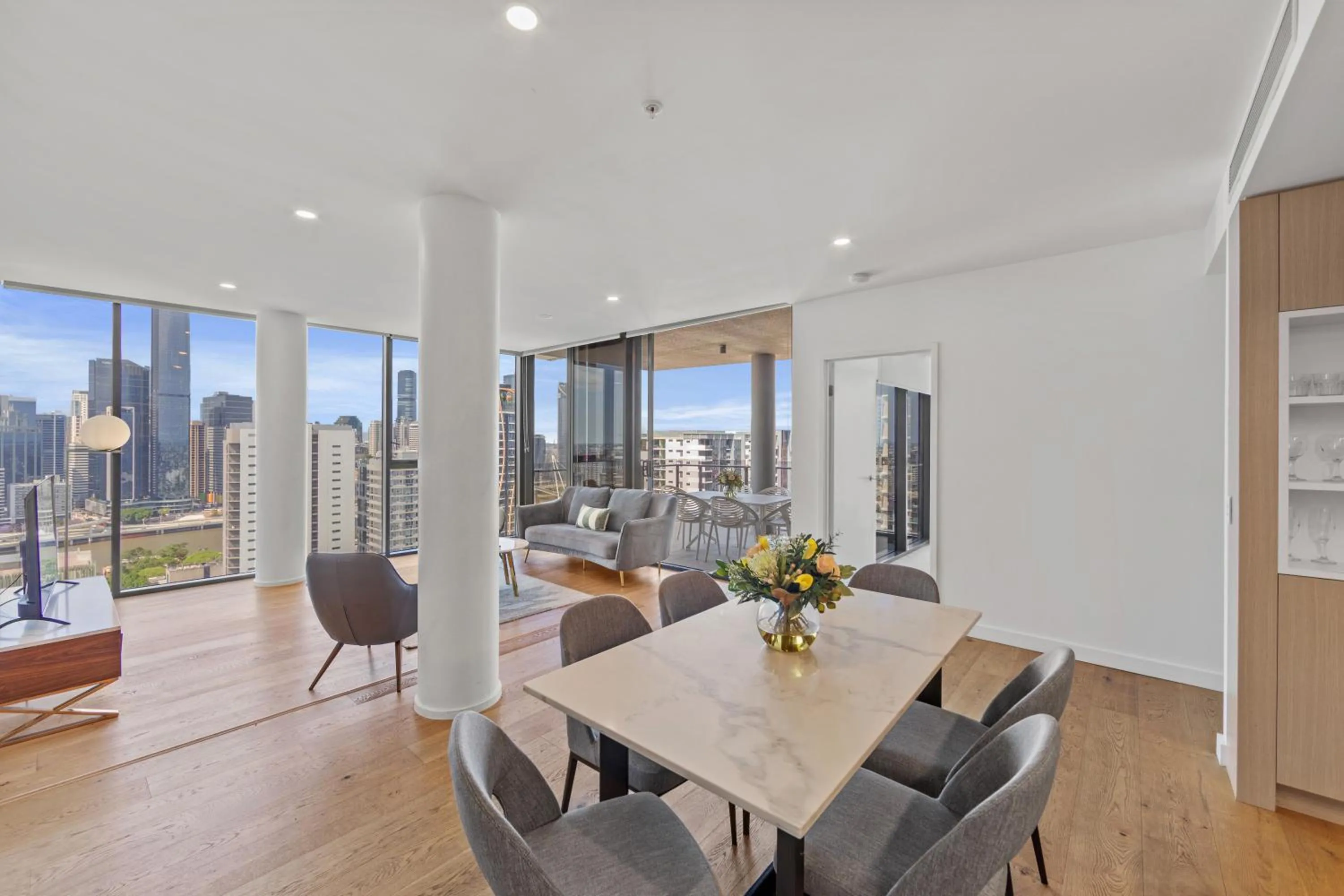 Dining area in Brisbane One Apartments by CLLIX