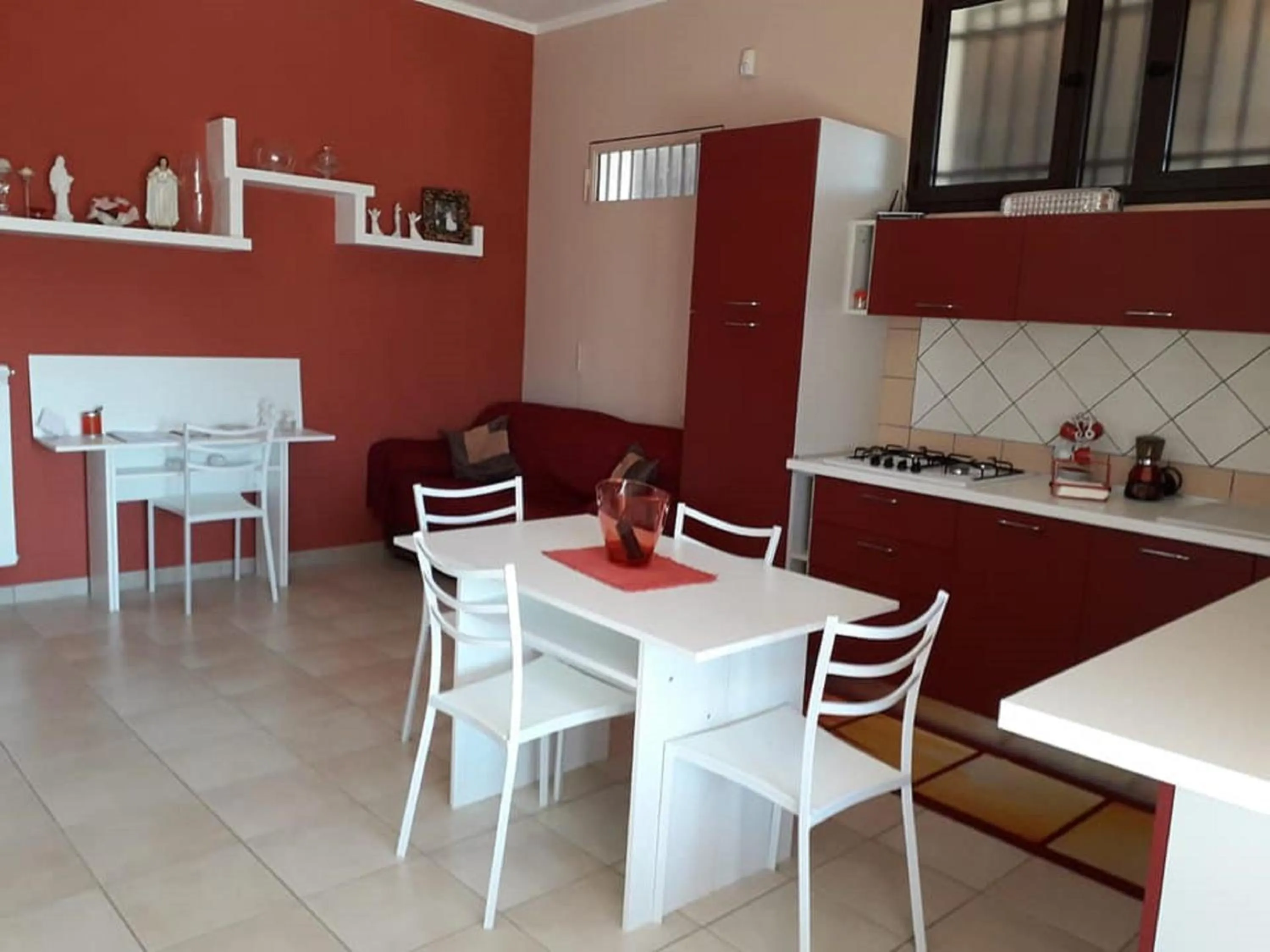 Communal kitchen in B&b Villa Santa Sofia by holidayngo