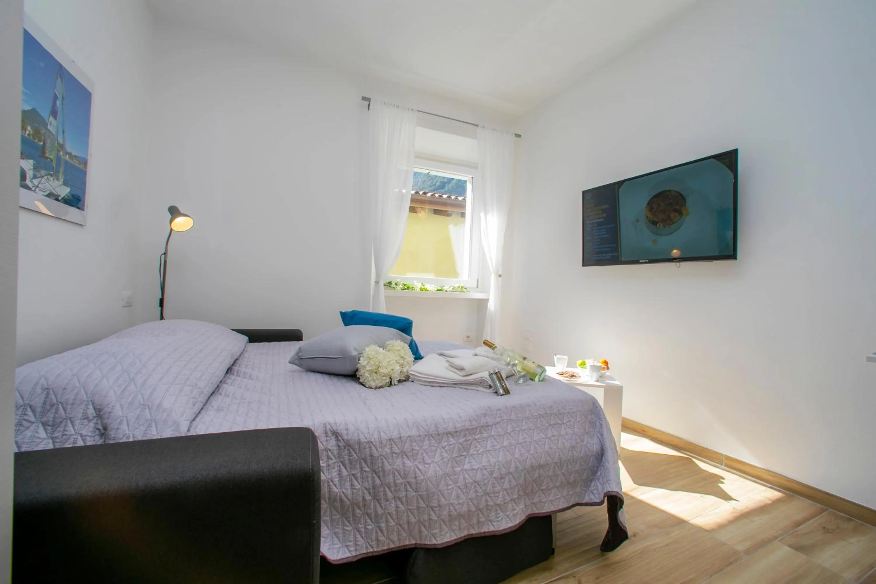 Bedroom in Nido sui Tetti di Riva del Garda - Happy Rentals