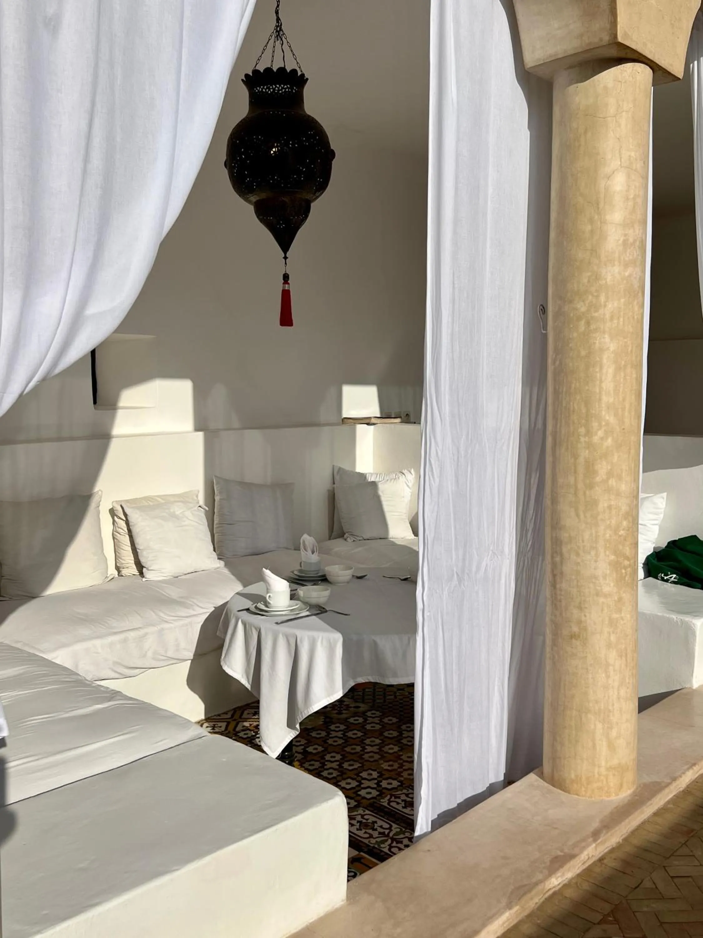 Seating area, Bed in Riad Tizwa Marrakech