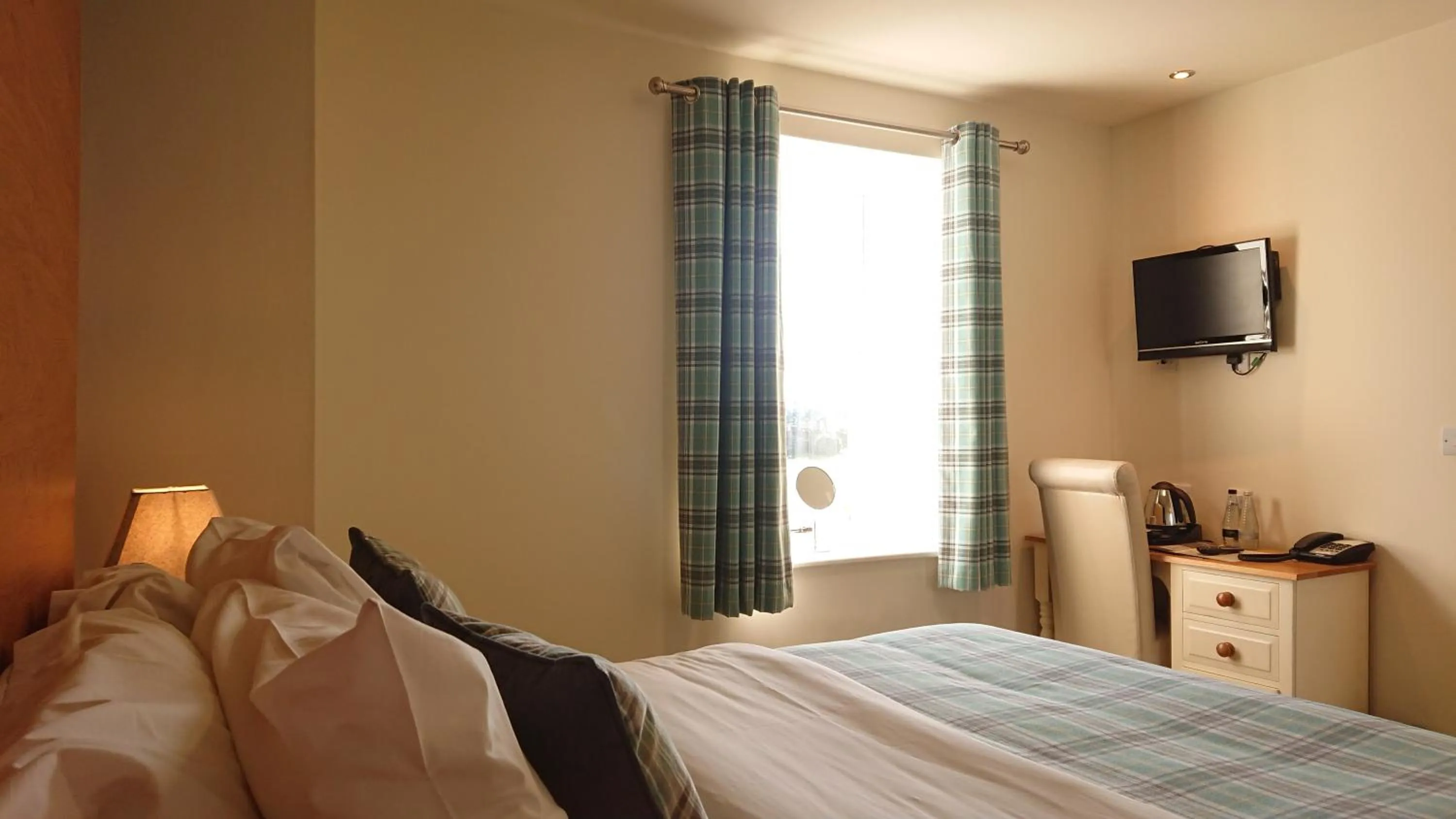 Bed in The Craven Heifer Inn