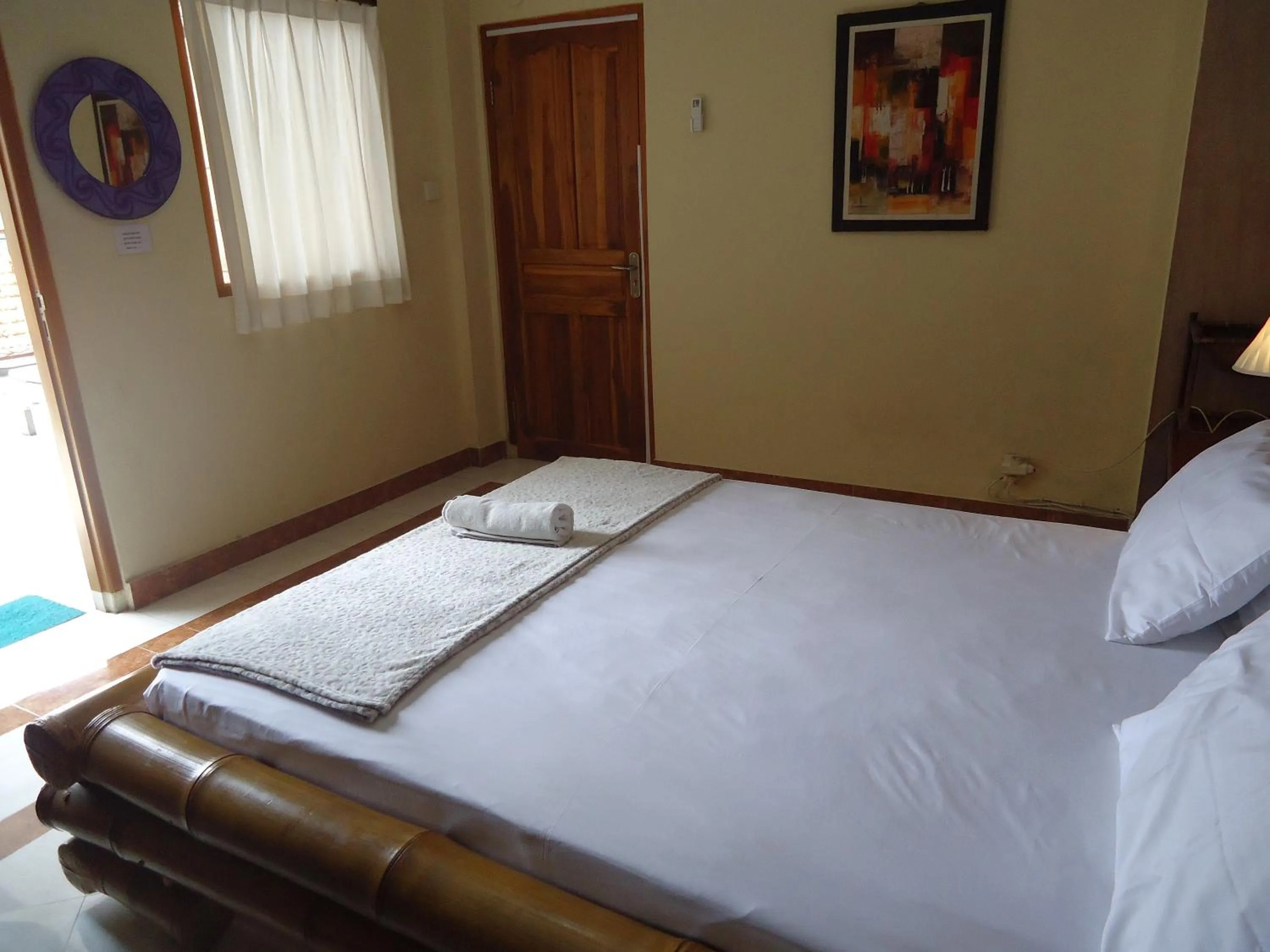 Bed in The Reinhold Guesthouse Bali