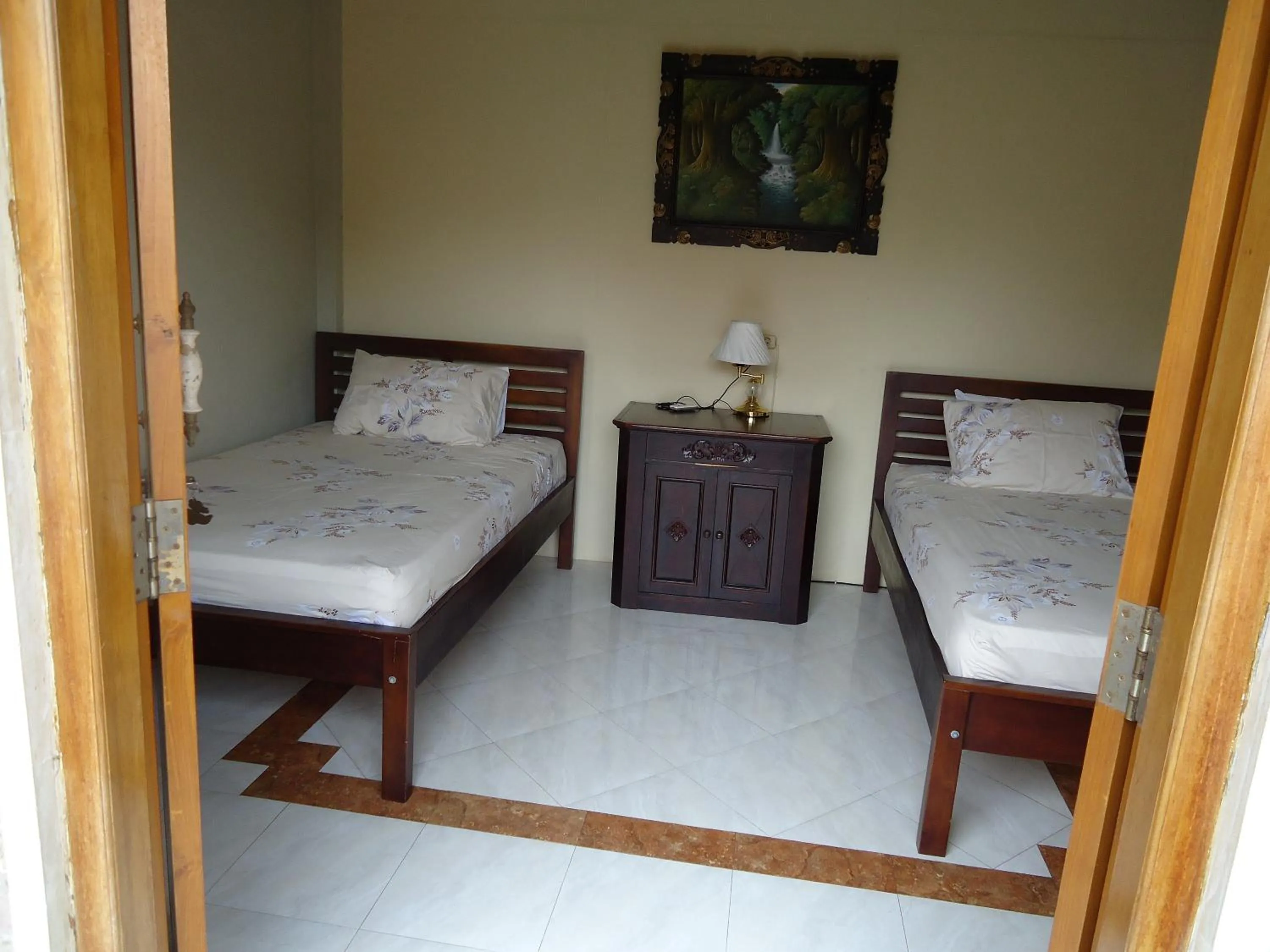 Photo of the whole room, Bed in The Reinhold Guesthouse Bali