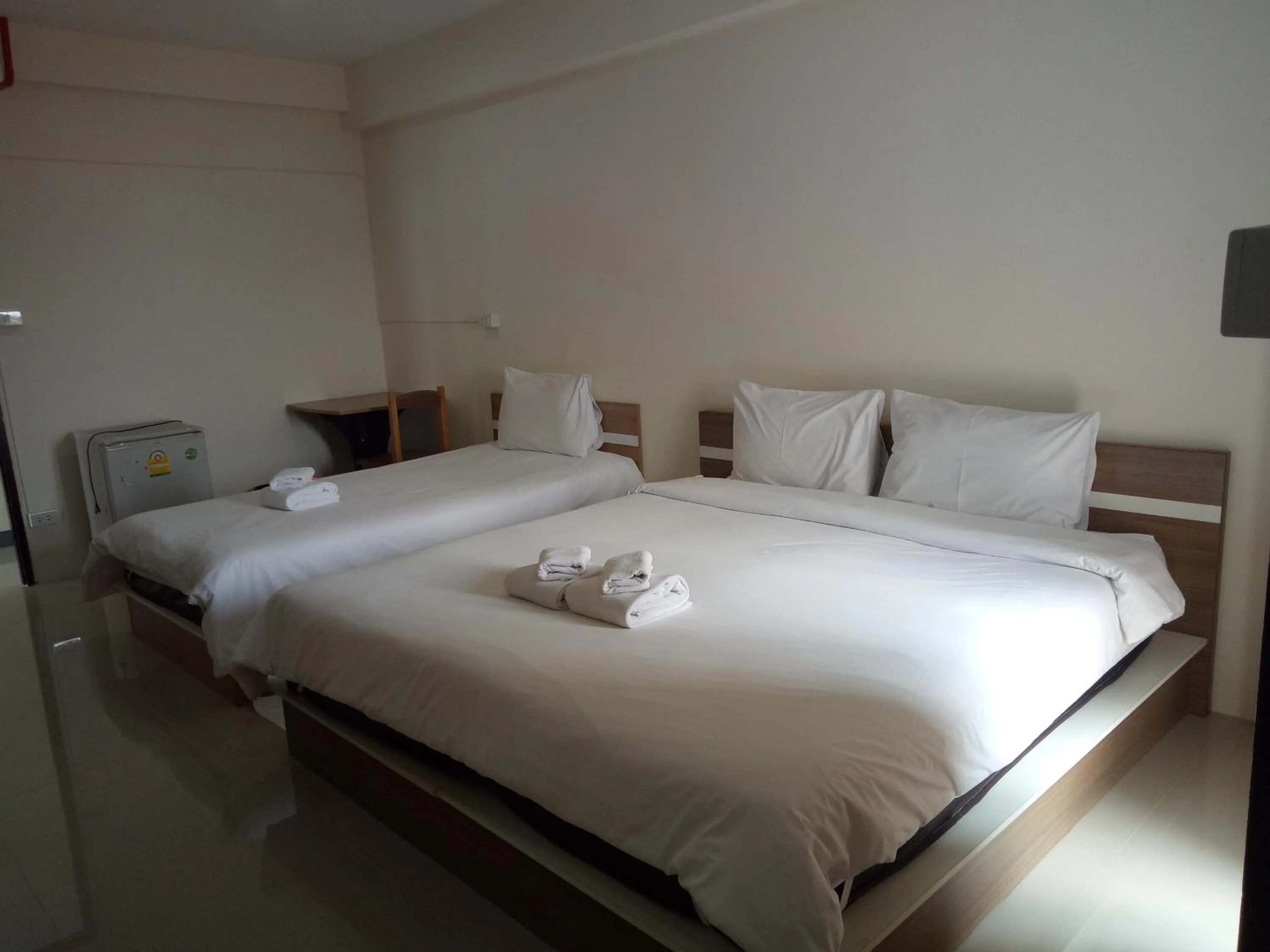 Bed in Komol Residence Bangkok