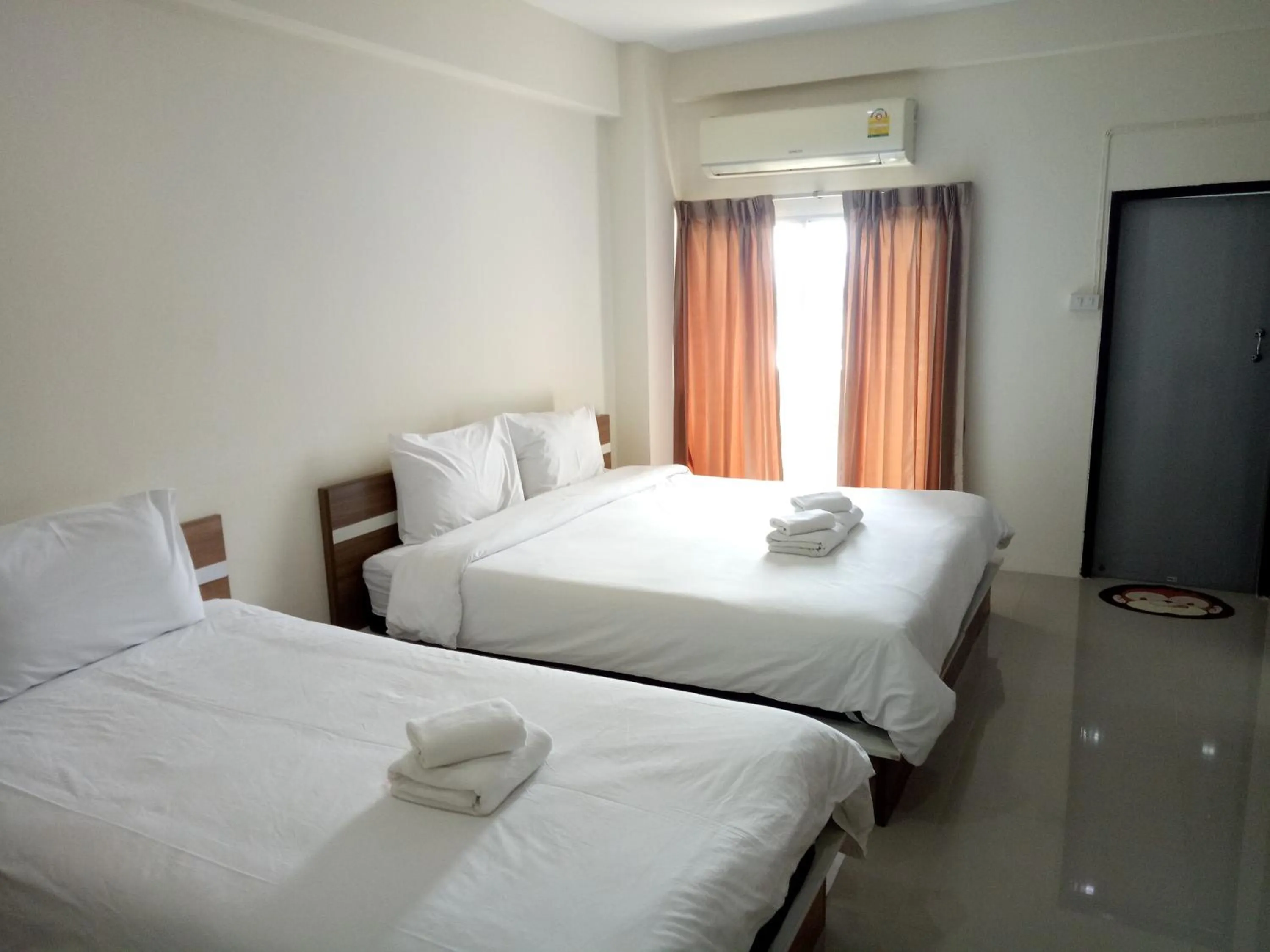 Bed in Komol Residence Bangkok