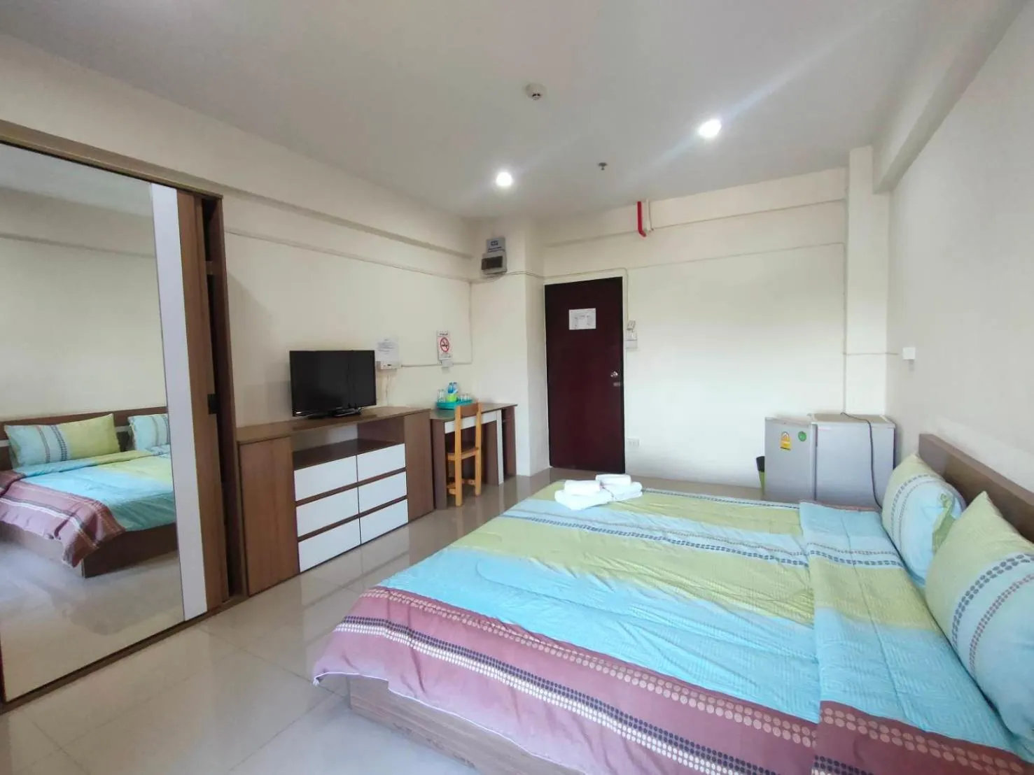 Bed in Komol Residence Bangkok