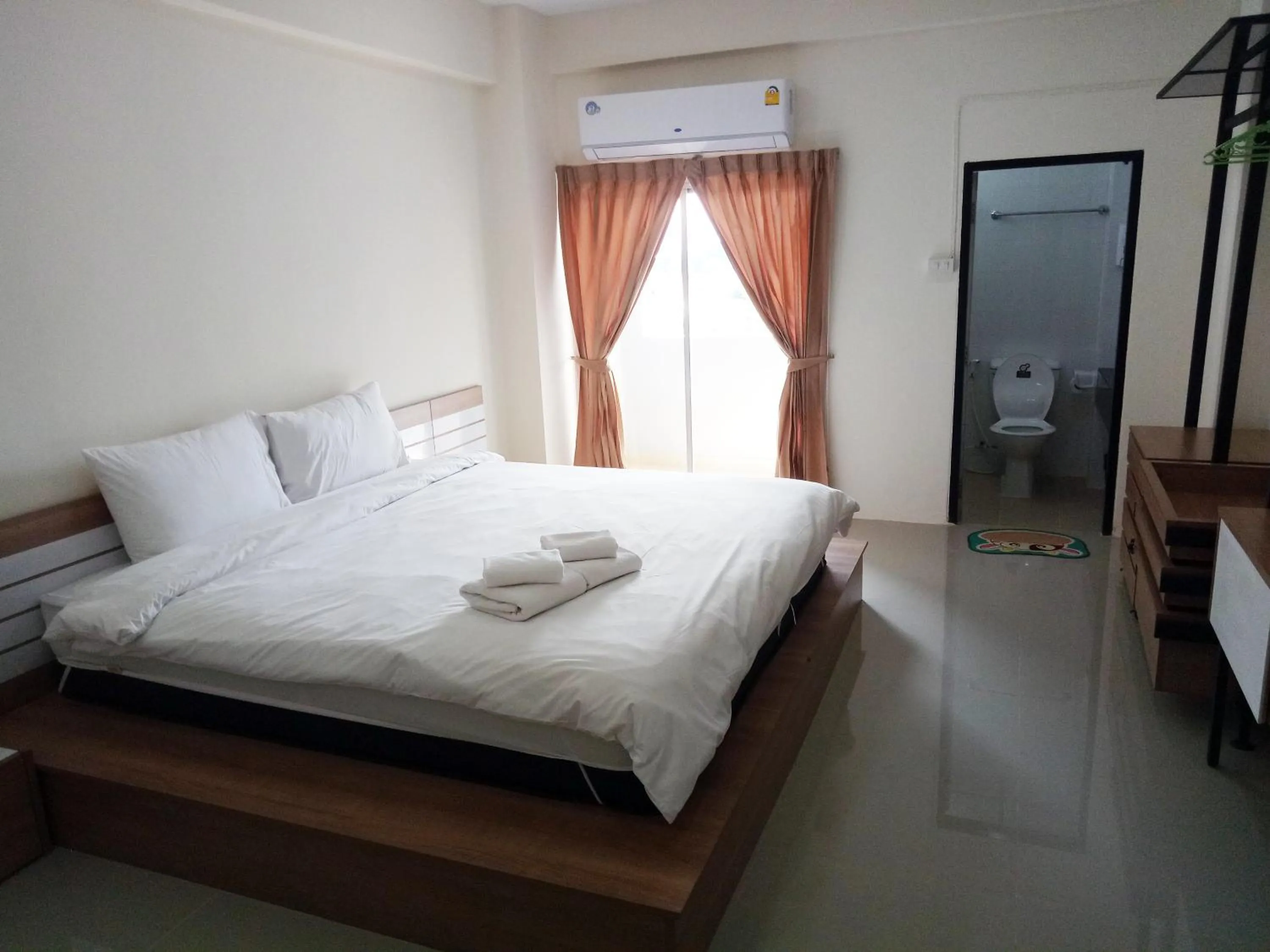 Bed in Komol Residence Bangkok