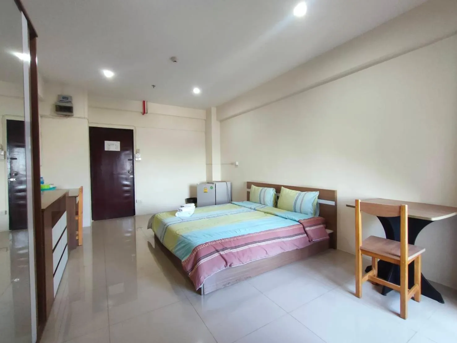 Bed in Komol Residence Bangkok