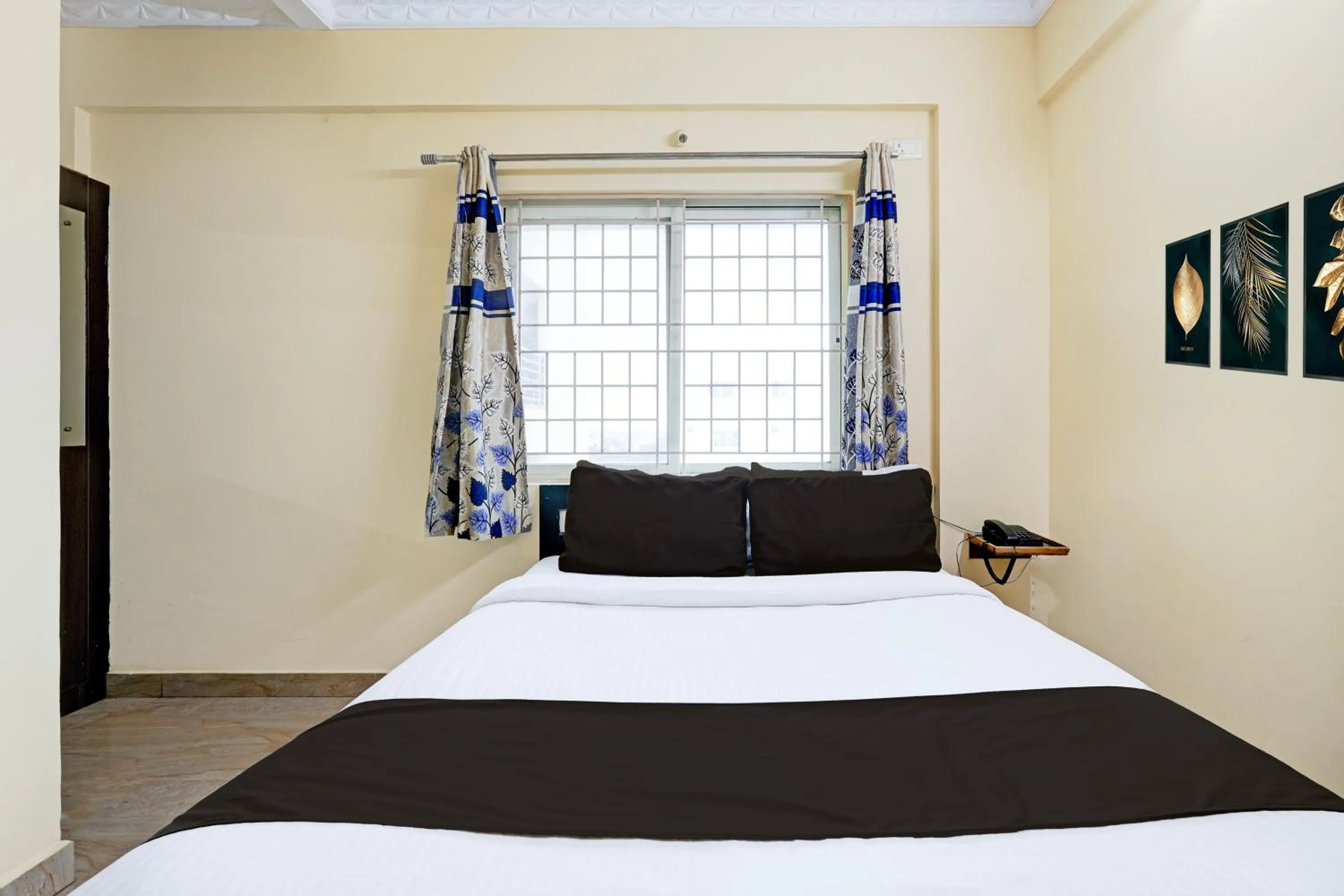 Bedroom in Hotel O Ganakkal Near BGS Hospital Junction formerly Omkar Inn.