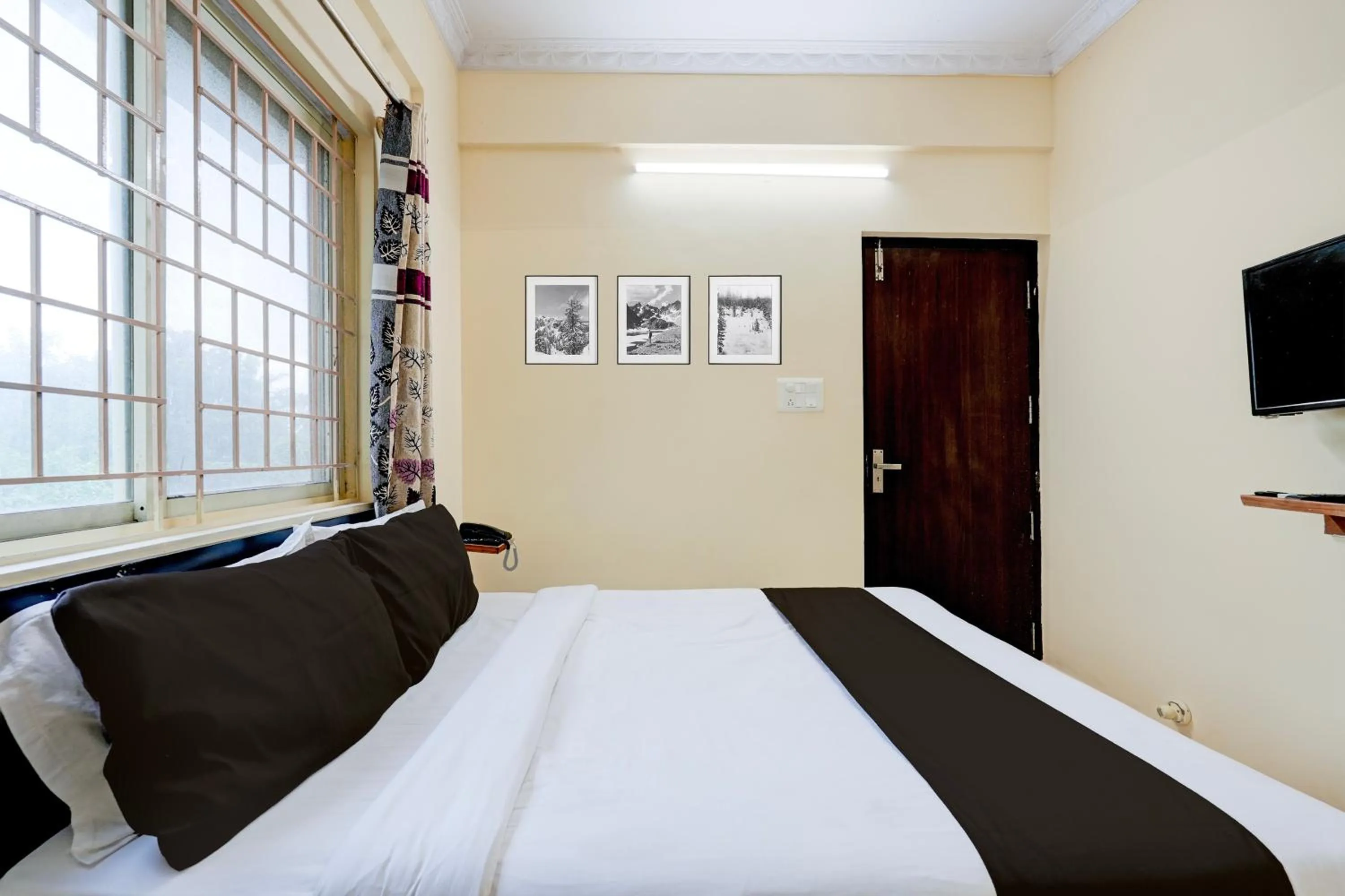Bedroom in Hotel O Ganakkal Near BGS Hospital Junction formerly Omkar Inn.