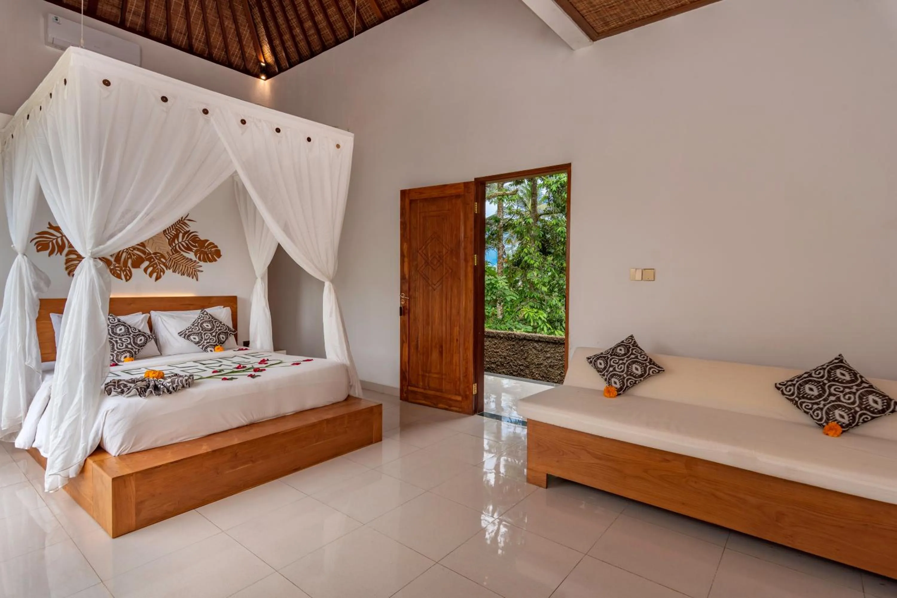 Bed in The Alus Cottage and Villa