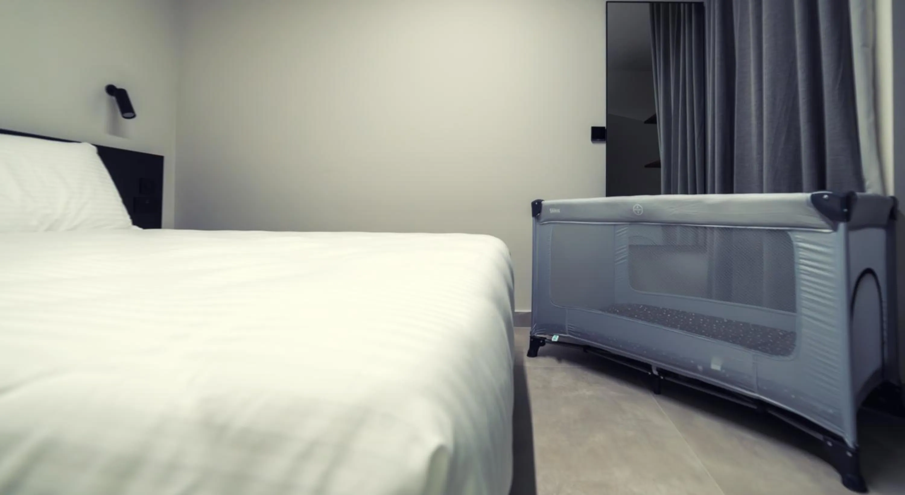 Bed in Onyx Suites & Apartments