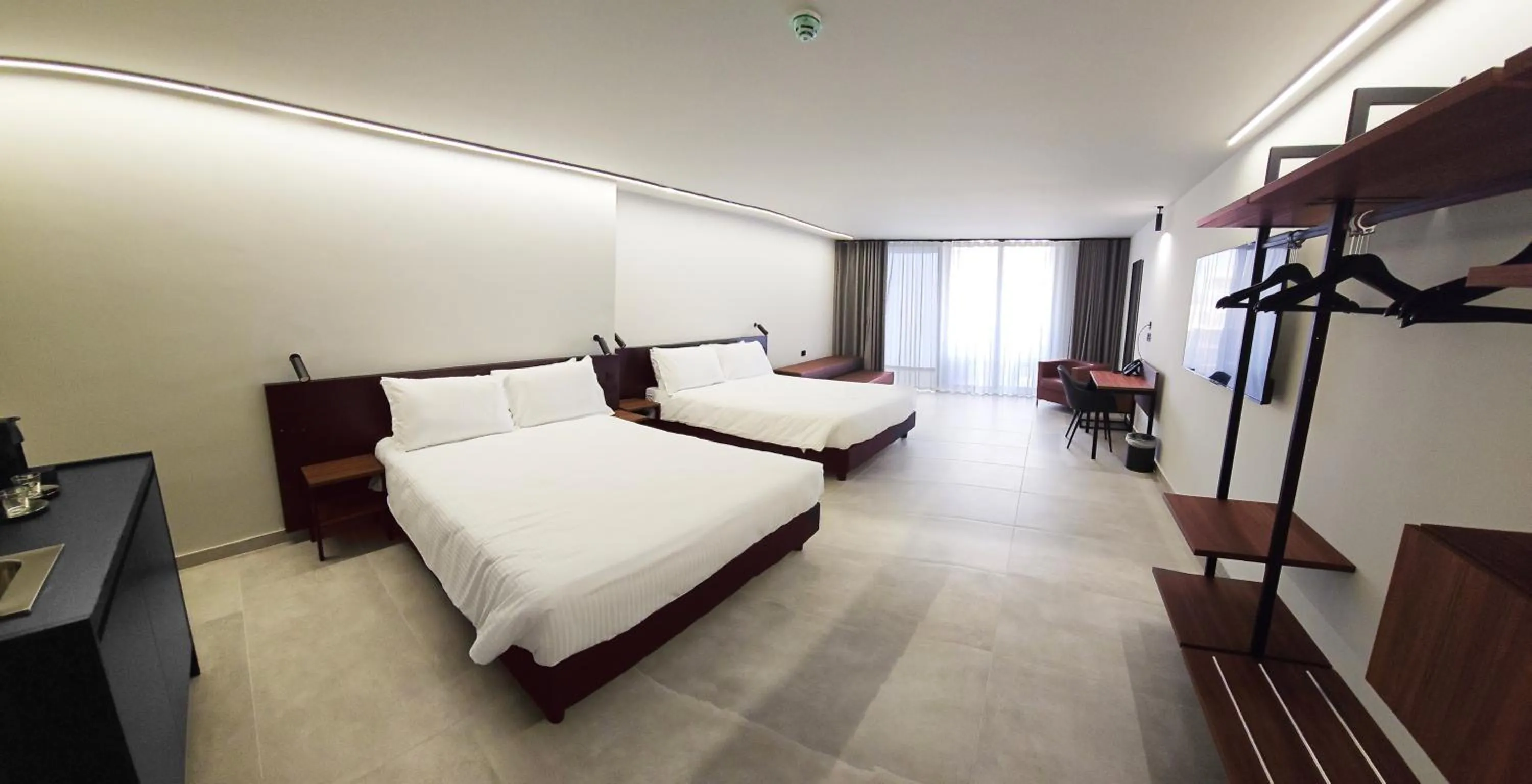 Bed in Onyx Suites & Apartments