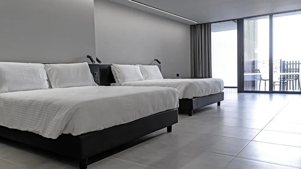 Bed in Onyx Suites & Apartments