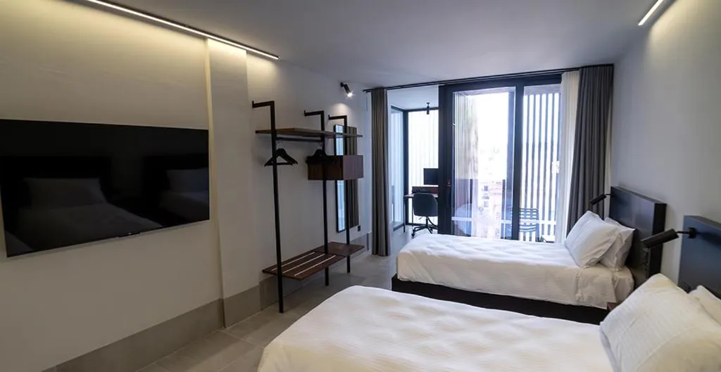 Bed in Onyx Suites & Apartments