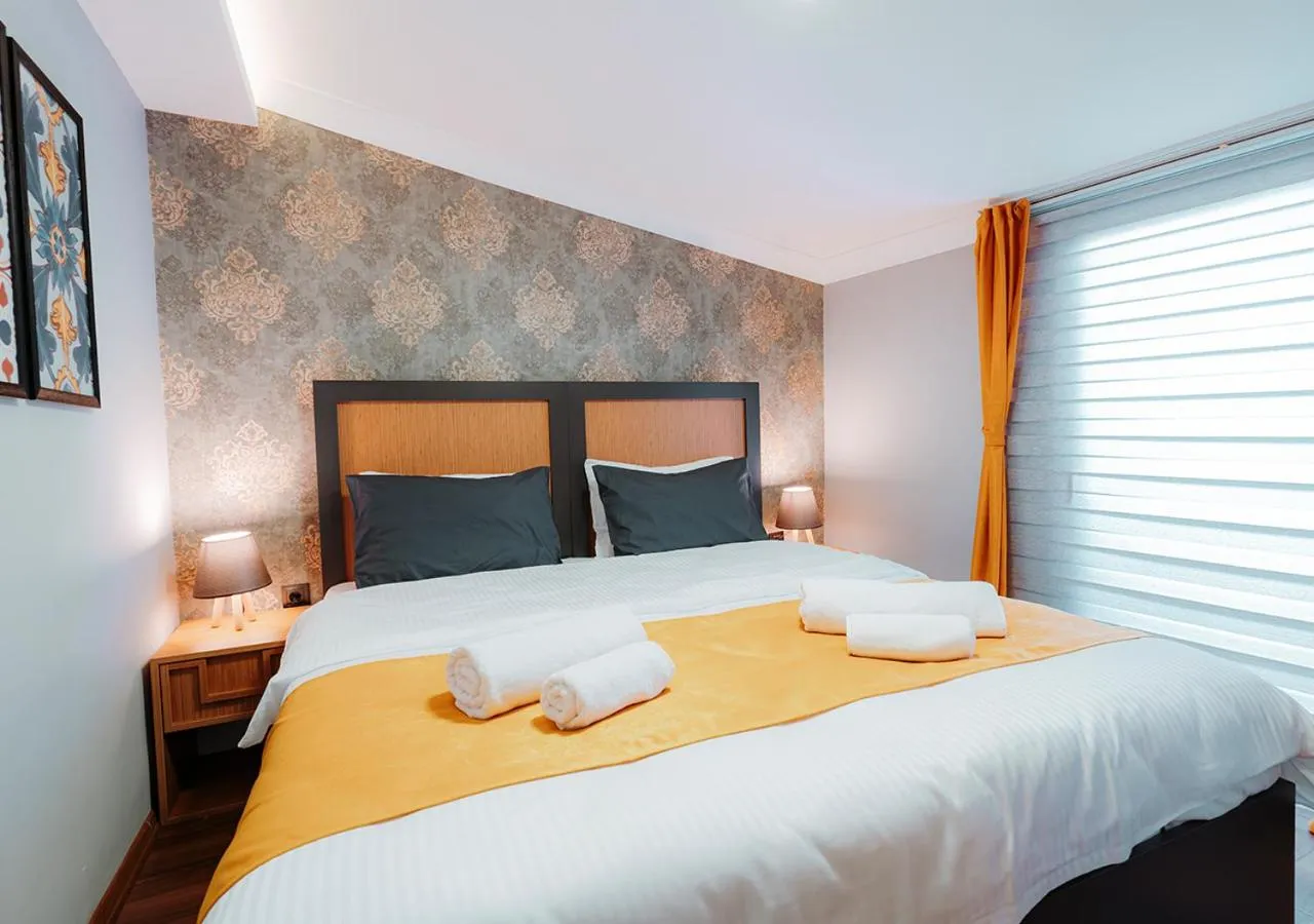 Bed in Umut Apartments