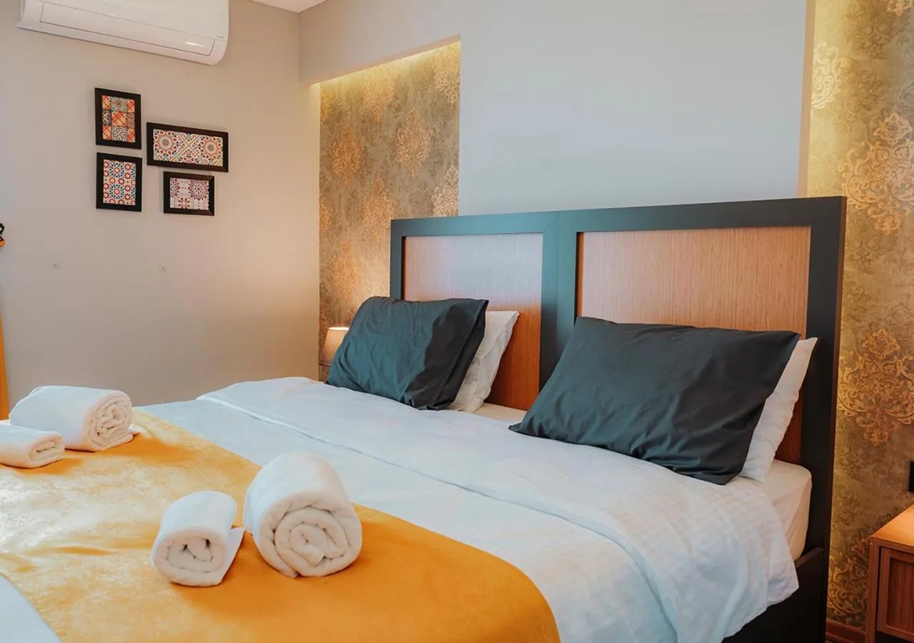 Bed in Umut Apartments