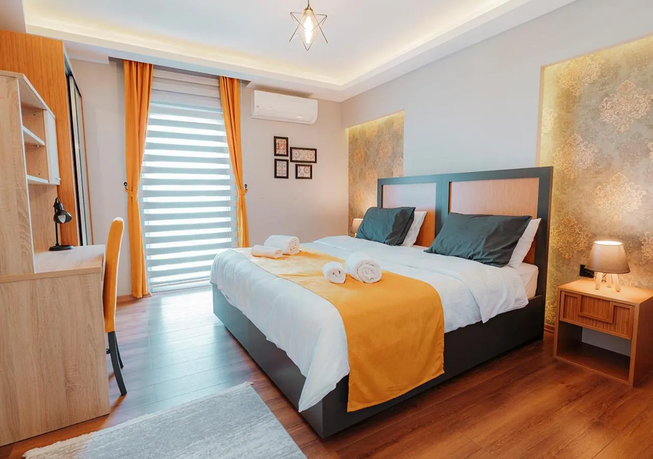 Bed in Umut Apartments