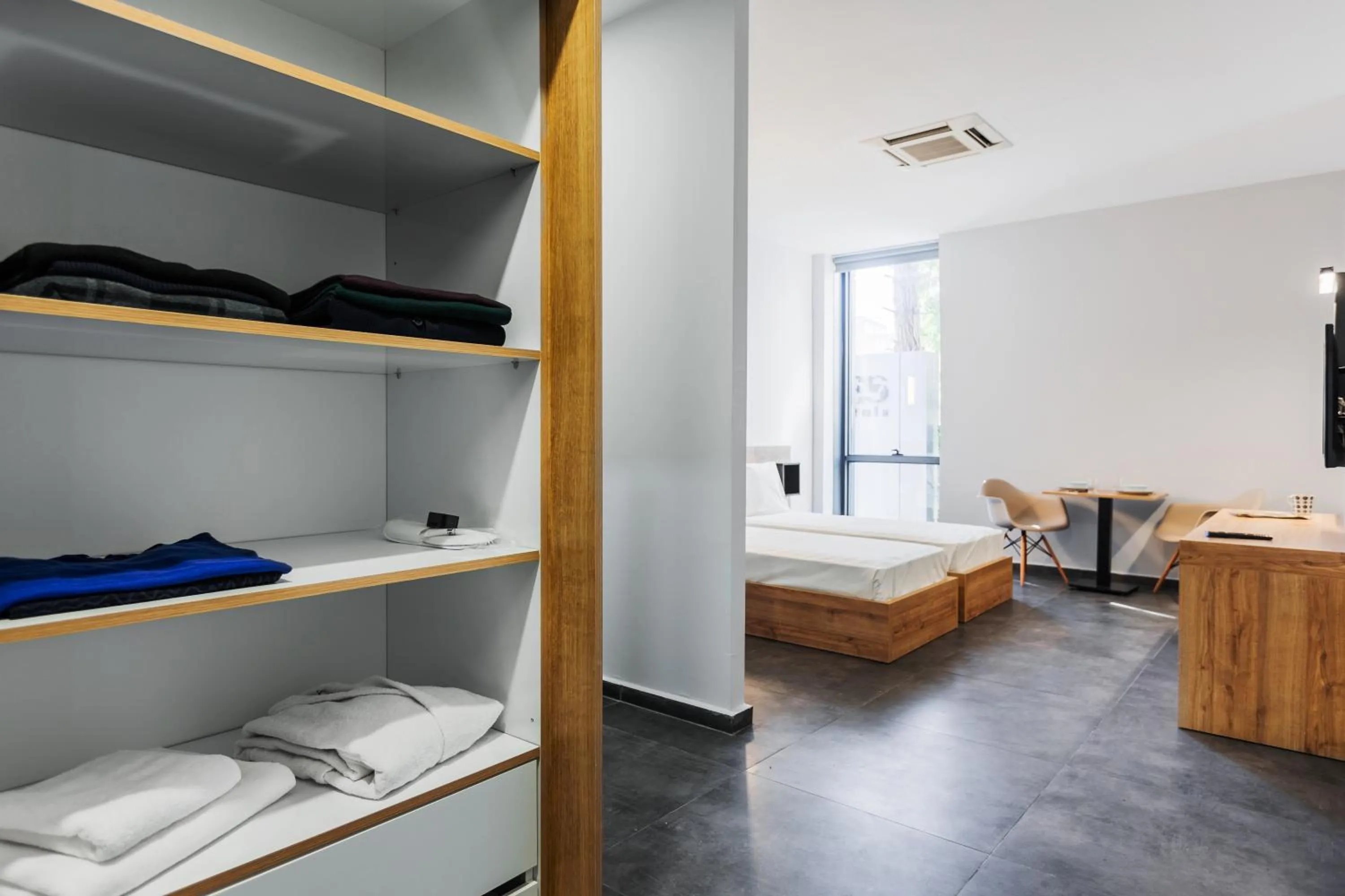 Bed in G Suites Luxury Rentals