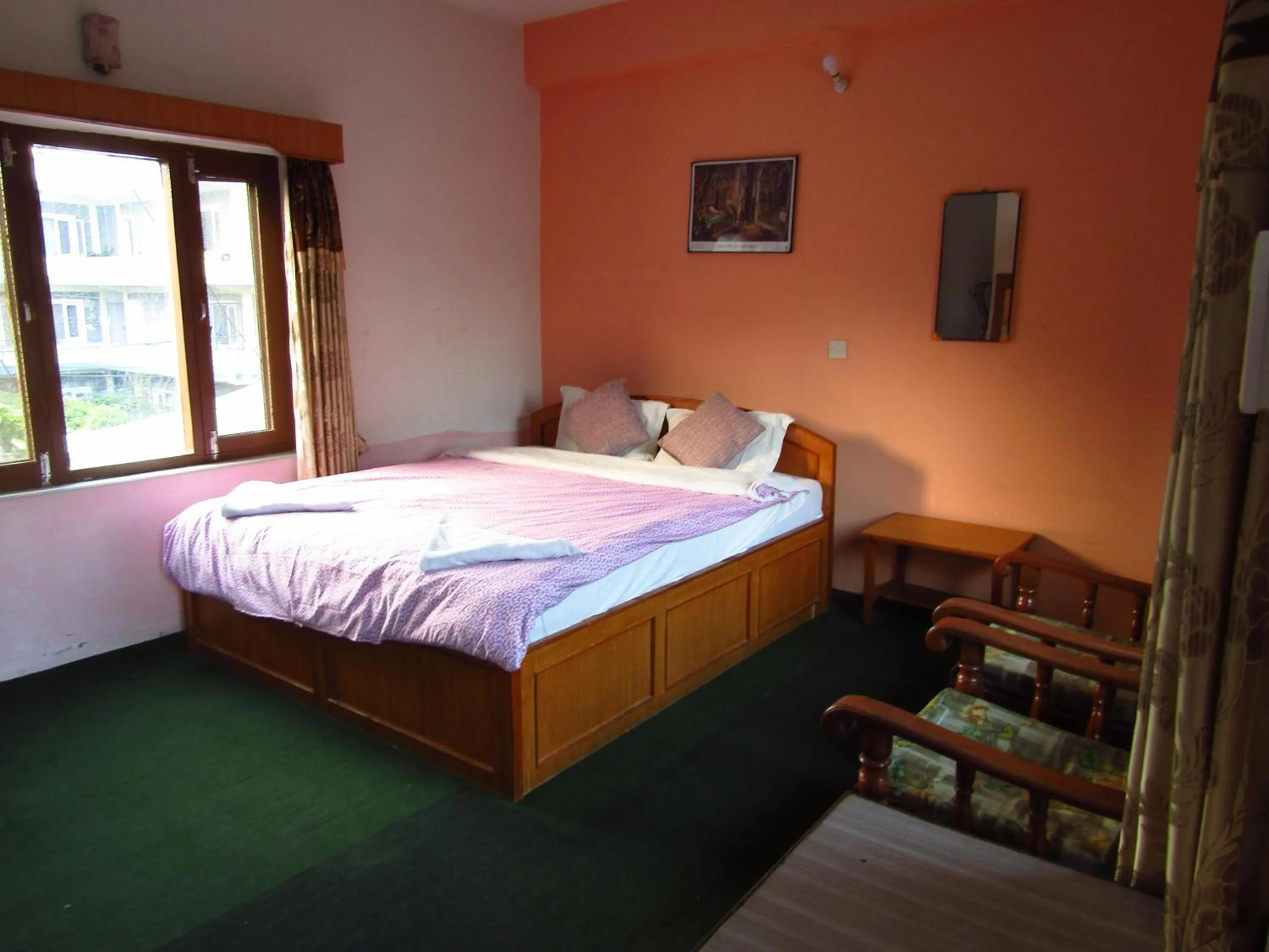 Bed in Hotel Lotus Inn