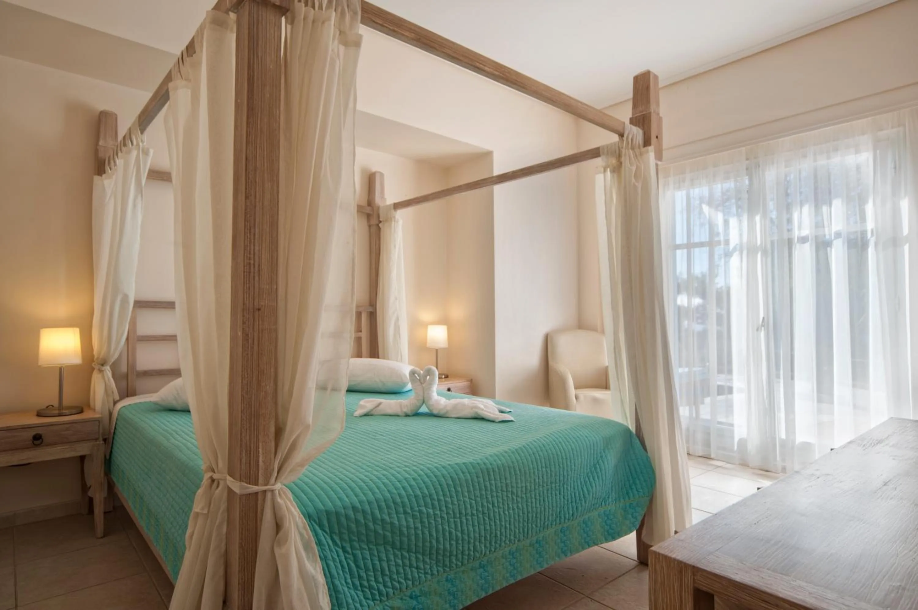 Bed in Alonissos Beach Bungalows And Suites Hotel