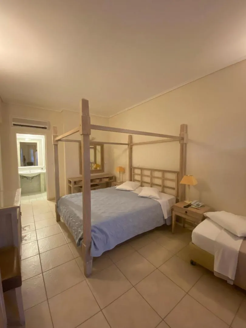 Bedroom, Bed in Alonissos Beach Bungalows And Suites Hotel