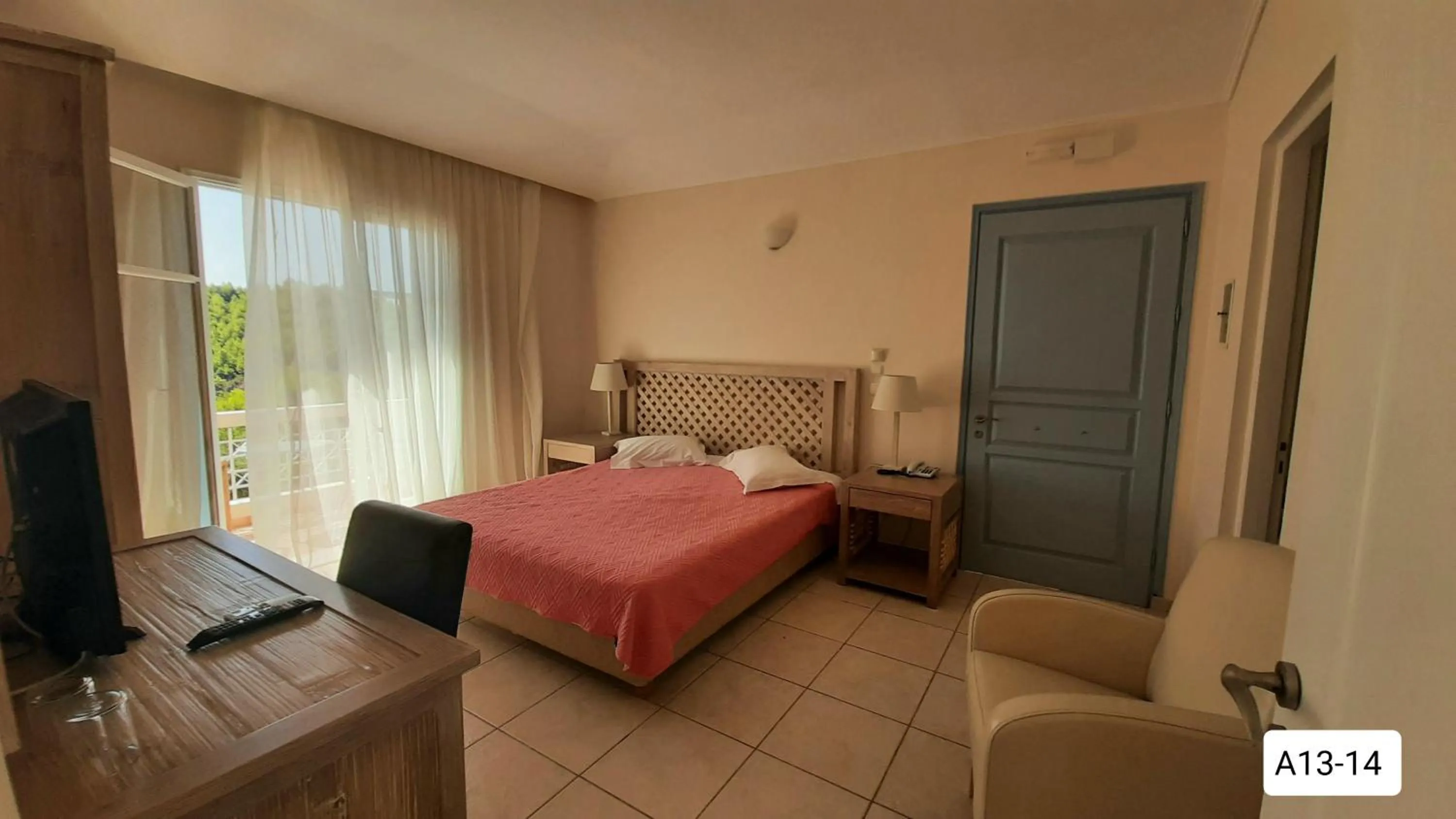 Bed in Alonissos Beach Bungalows And Suites Hotel