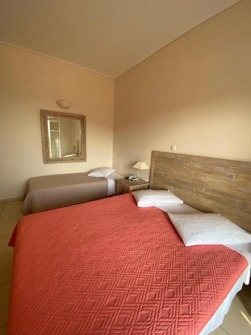 Bedroom, Bed in Alonissos Beach Bungalows And Suites Hotel