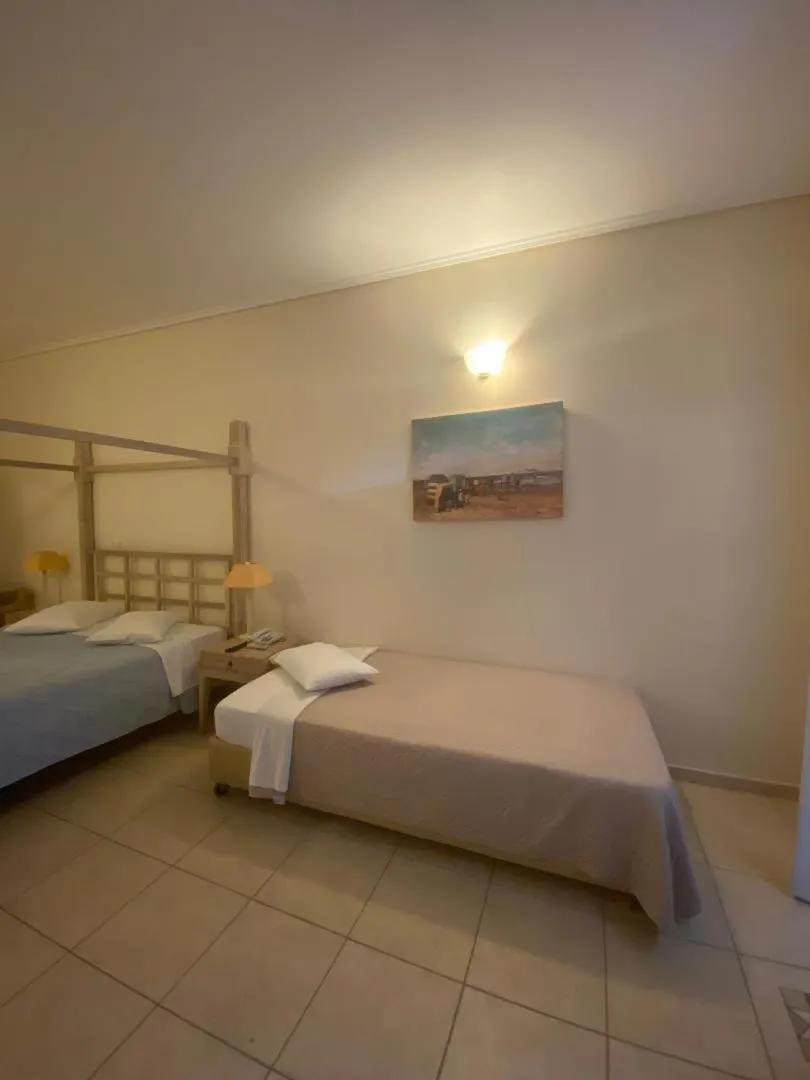 Bedroom, Bed in Alonissos Beach Bungalows And Suites Hotel