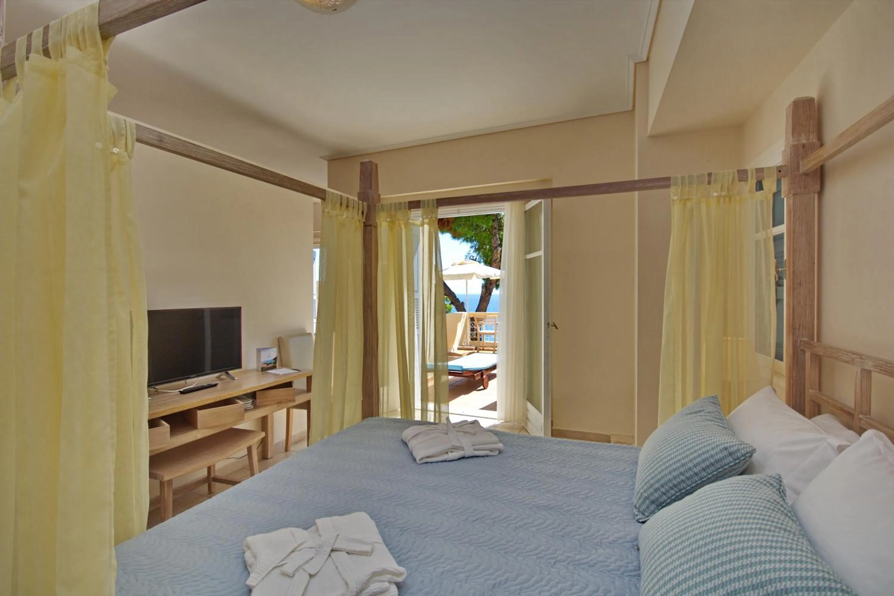 Bedroom, Bed in Alonissos Beach Bungalows And Suites Hotel