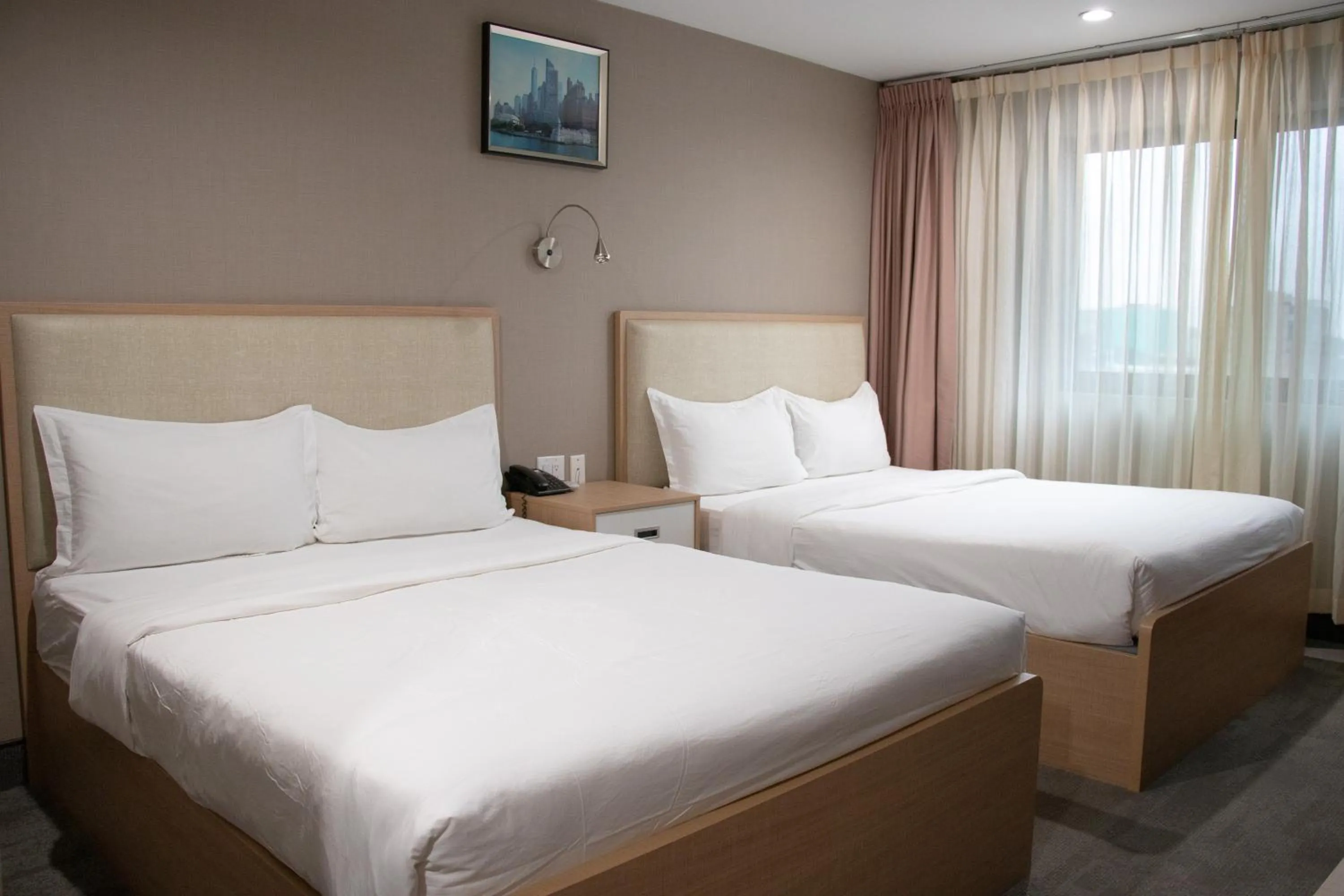 Bed in LIC Plaza Hotel