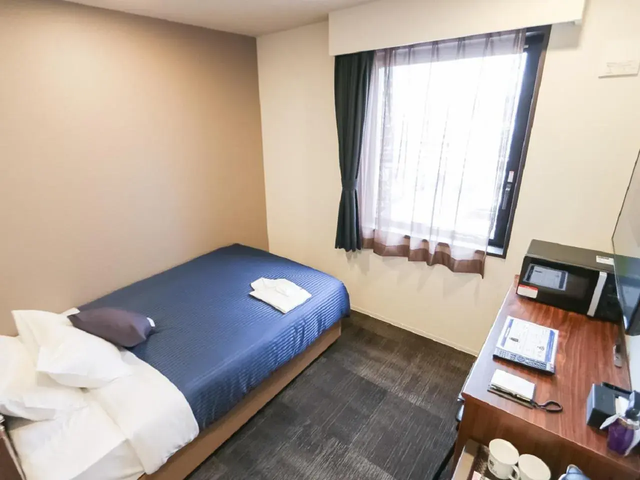 Bed in HOTEL LiVEMAX Aichi Toyota Ekimae Bed in HOTEL LiVEMAX Aichi Toyota Ekimae