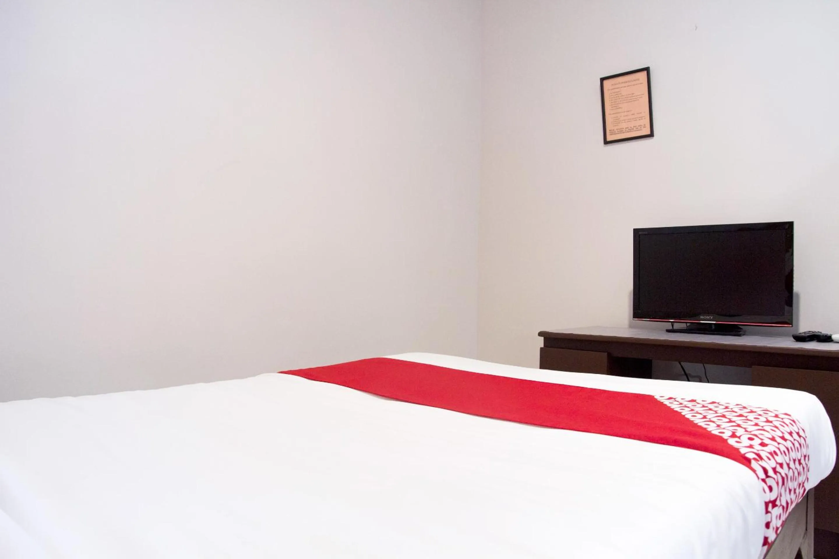 Bedroom in OYO 153 Espacio de Clarita Hometel