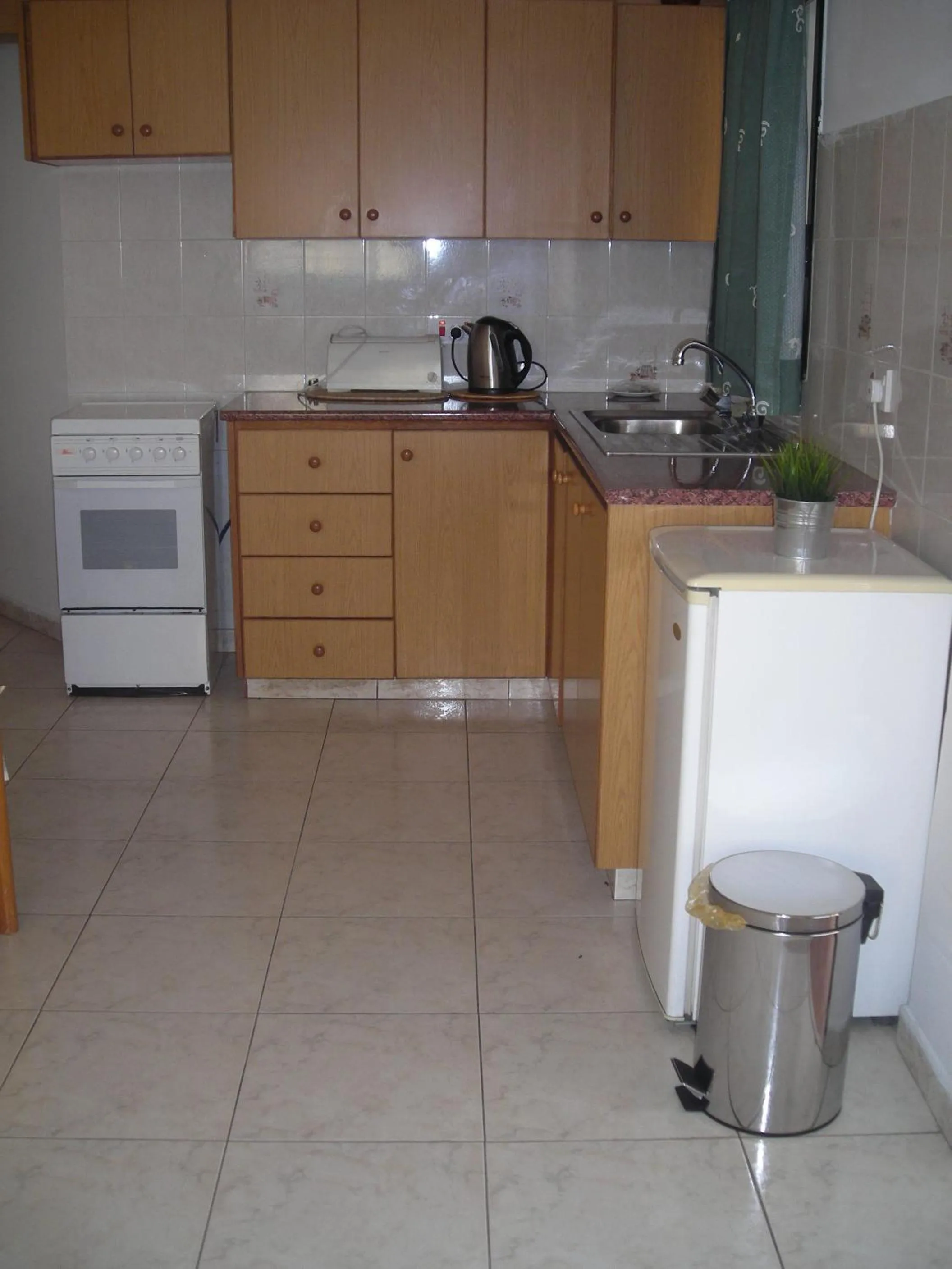 Kitchen or kitchenette in Angela Holiday Apartments