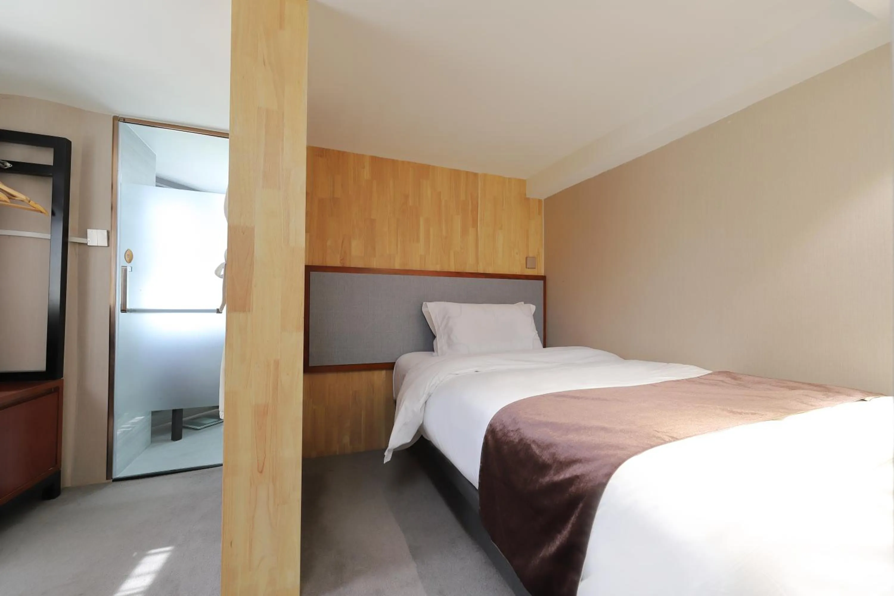 Bed in Mengguo Hotel Pudong Airport