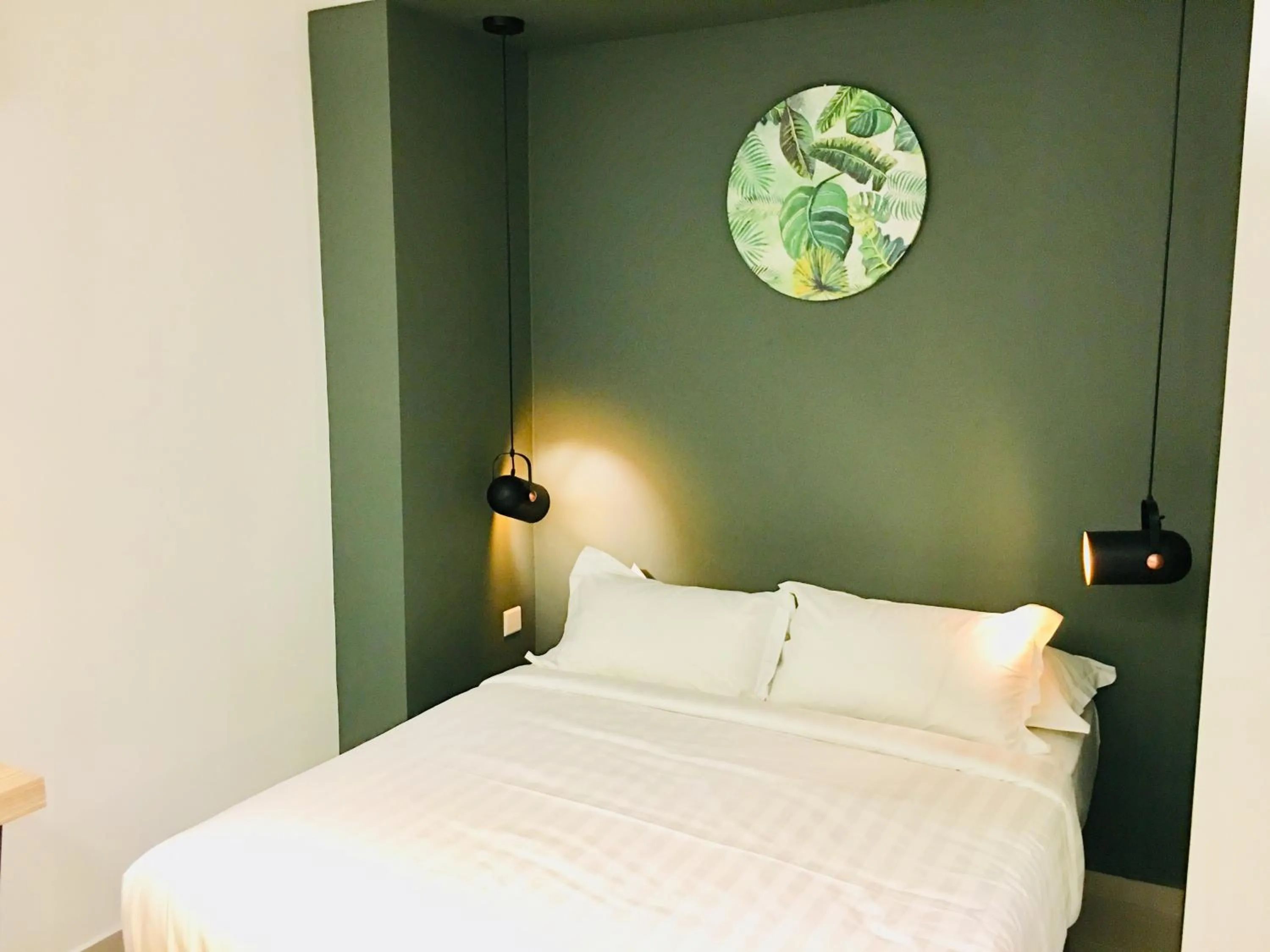 Bed in Enclave Business Hotel