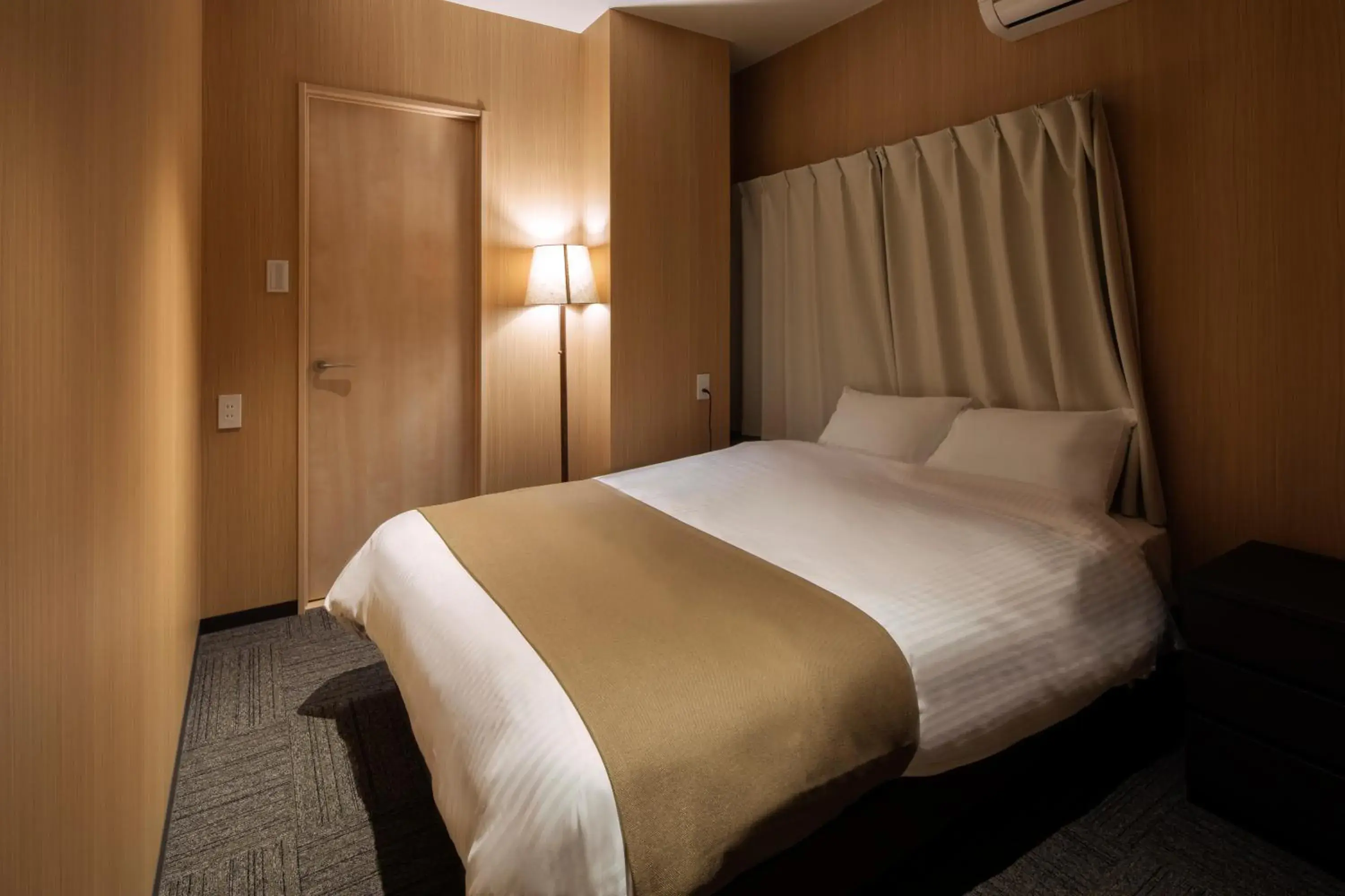 Photo of the whole room, Bed in Randor Residence Hiroshima Suites Photo of the whole room, Bed in Randor Residence Hiroshima Suites