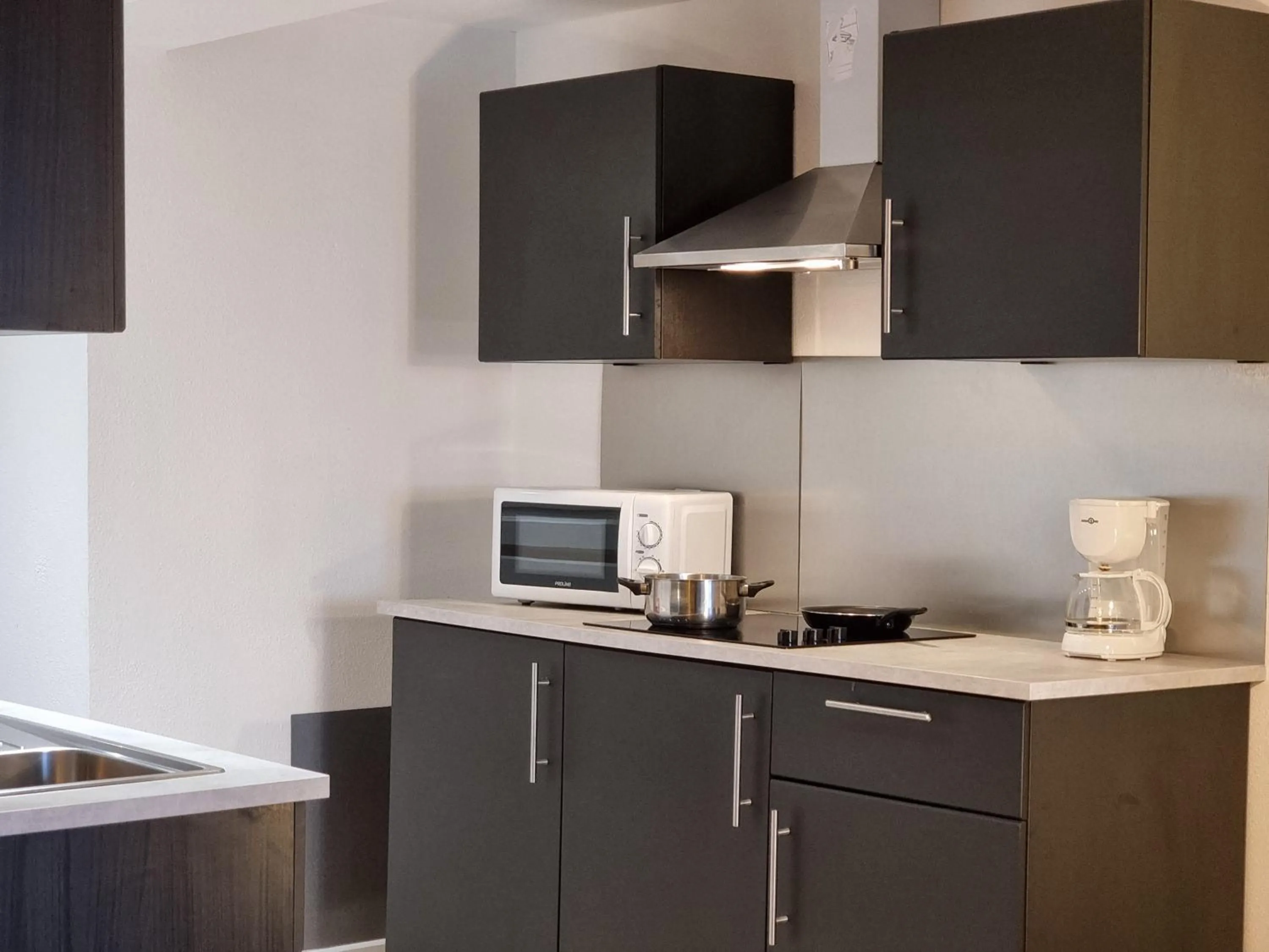 Kitchen or kitchenette in City Loft Apparthotel