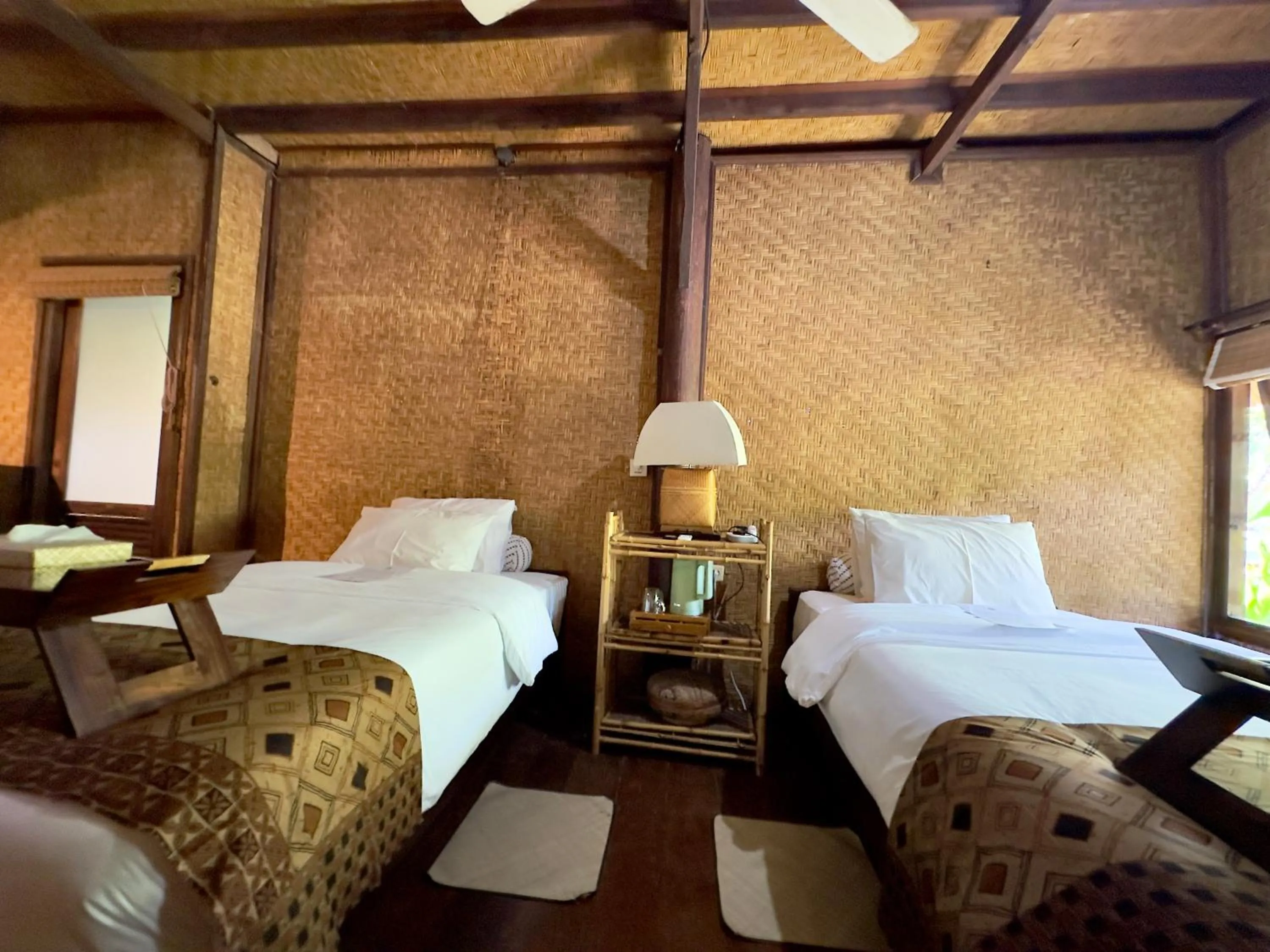 Bed in Aashaya Jasri Resort