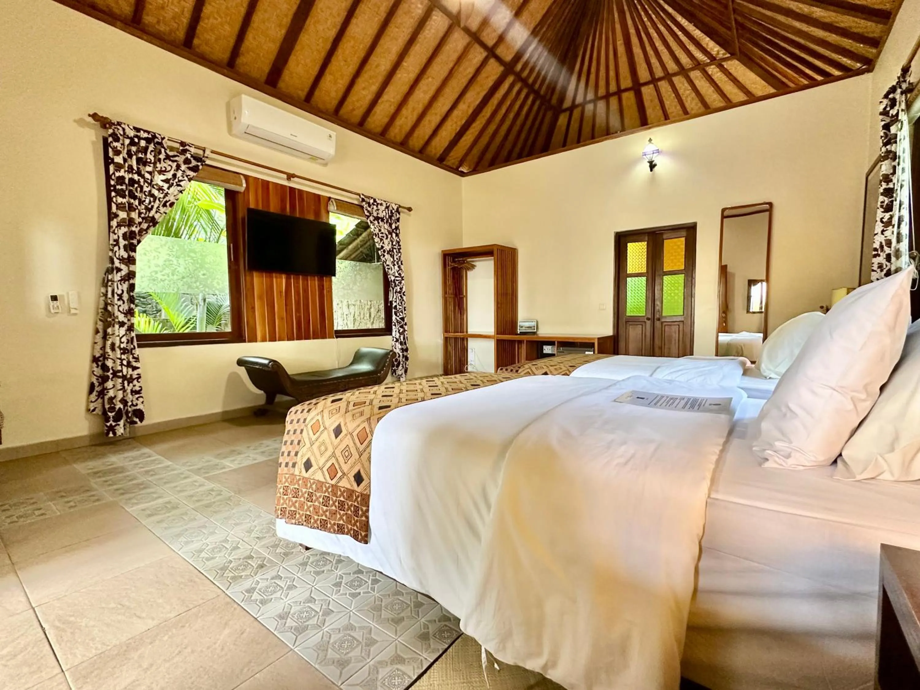 Bed in Aashaya Jasri Resort