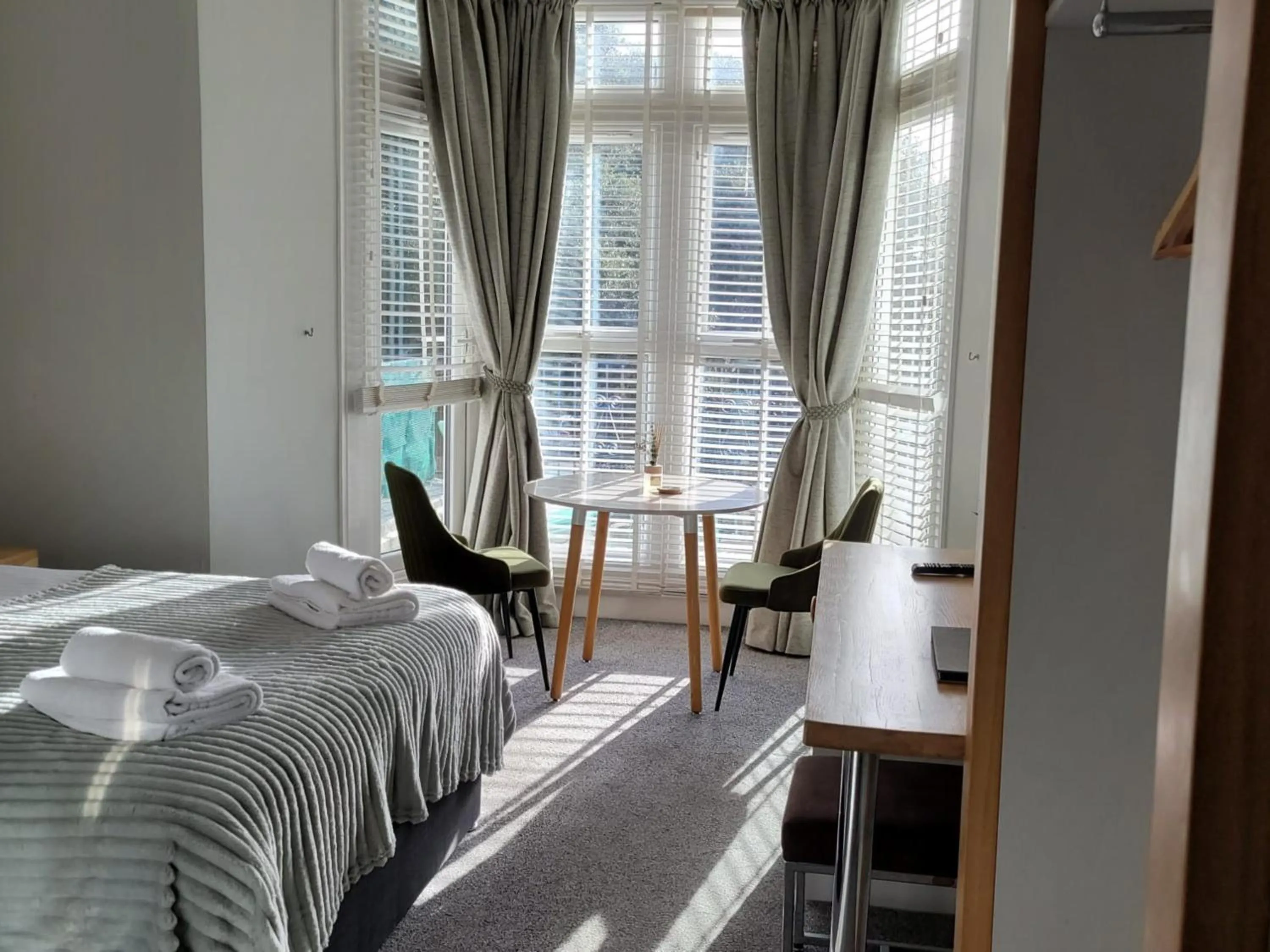 Living room, Bed in Harmony Apartments