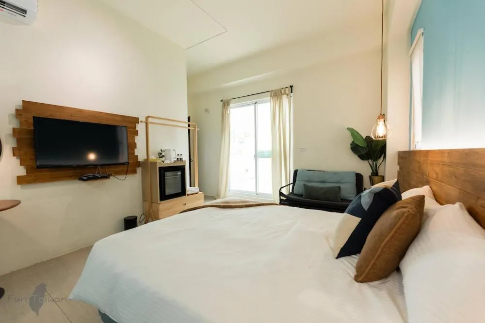 Bed in 沉靛旅宿 La Casa Indaco 墾丁夢幻島Villa
