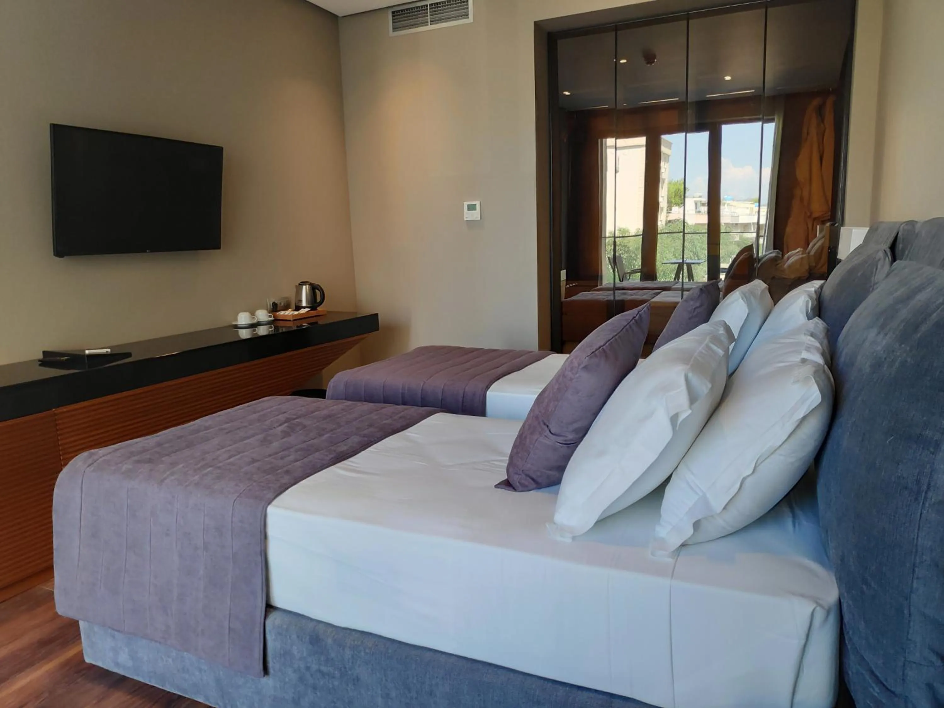 Bed in Supreme Hotel