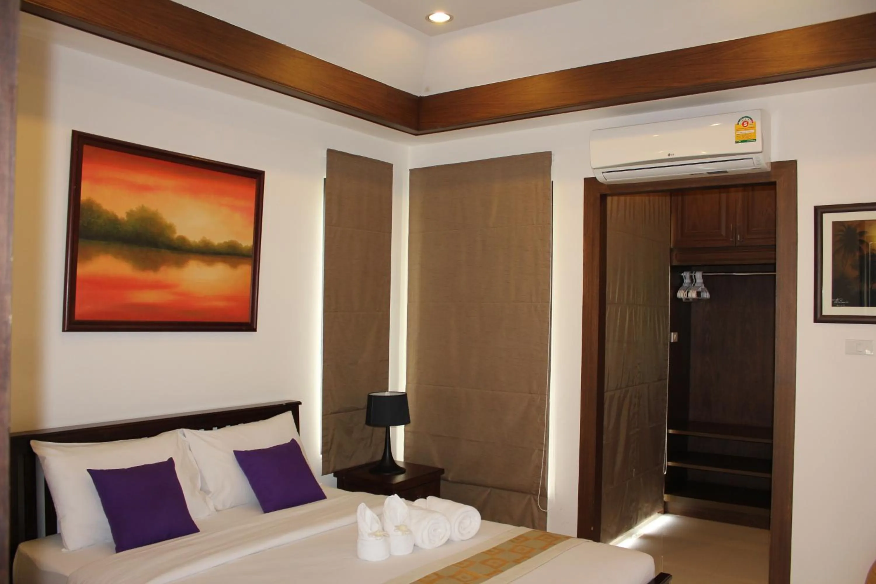 Bed in Leelawadee Garden Resort