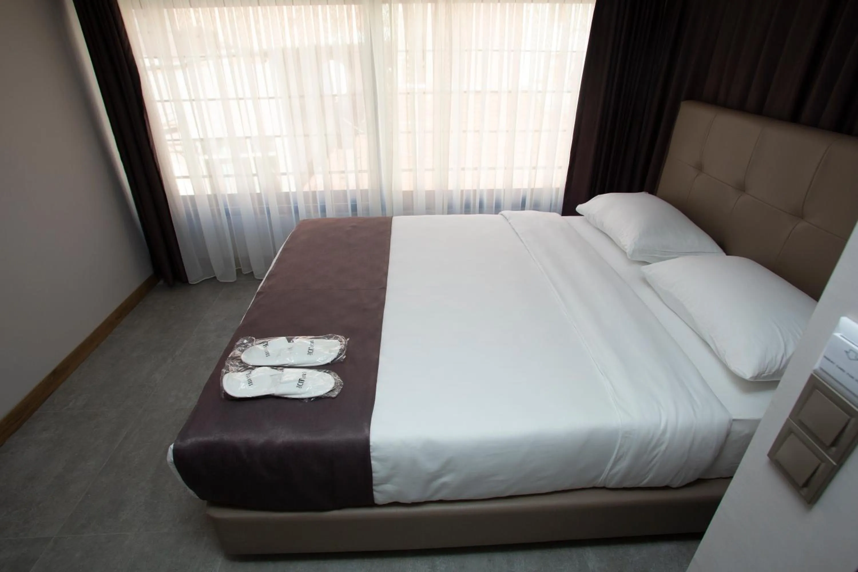 Bed in Jurnal Hotel