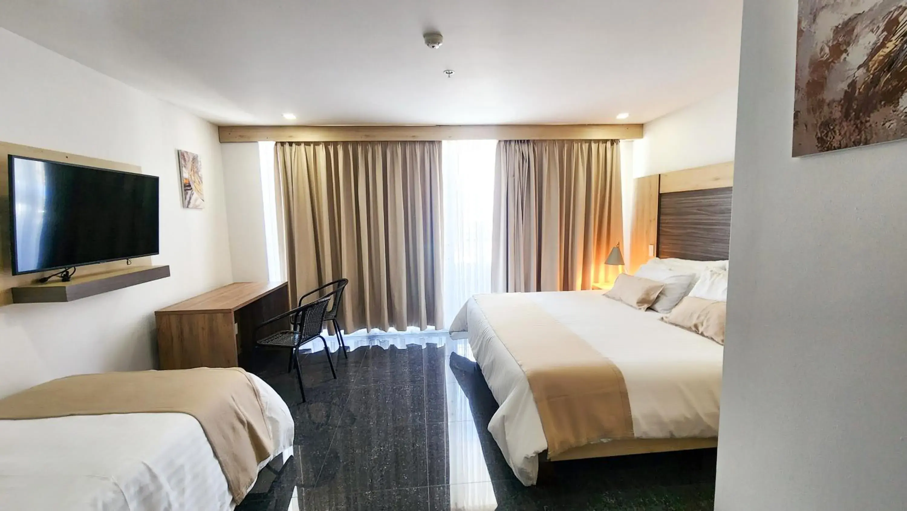 Triple Room in BE Suites Hotel Cali Triple Room in BE Suites Hotel Cali